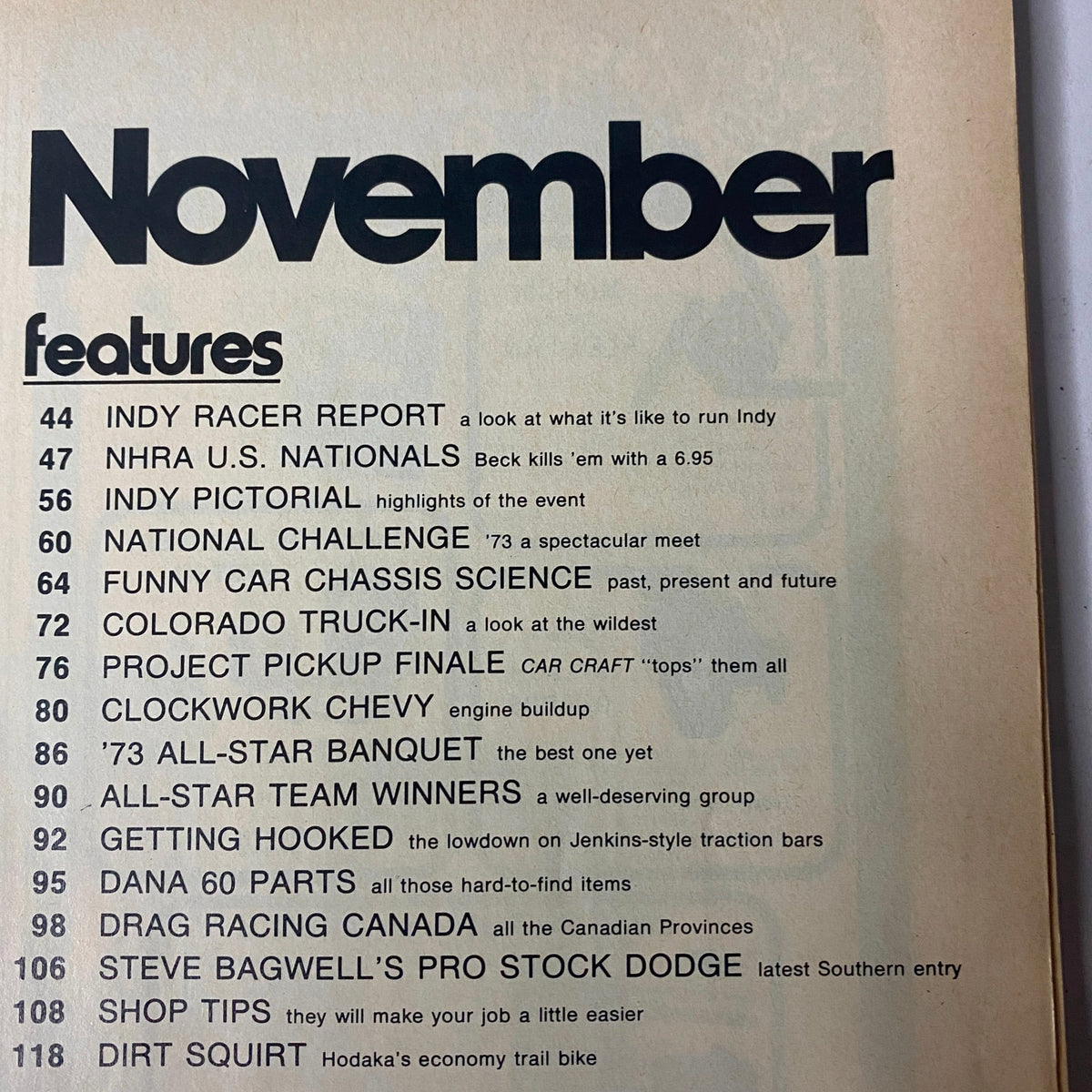 Contents page of Car Craft Magazine November 1973, listing features such as Indy Racer Report and other automotive topics.