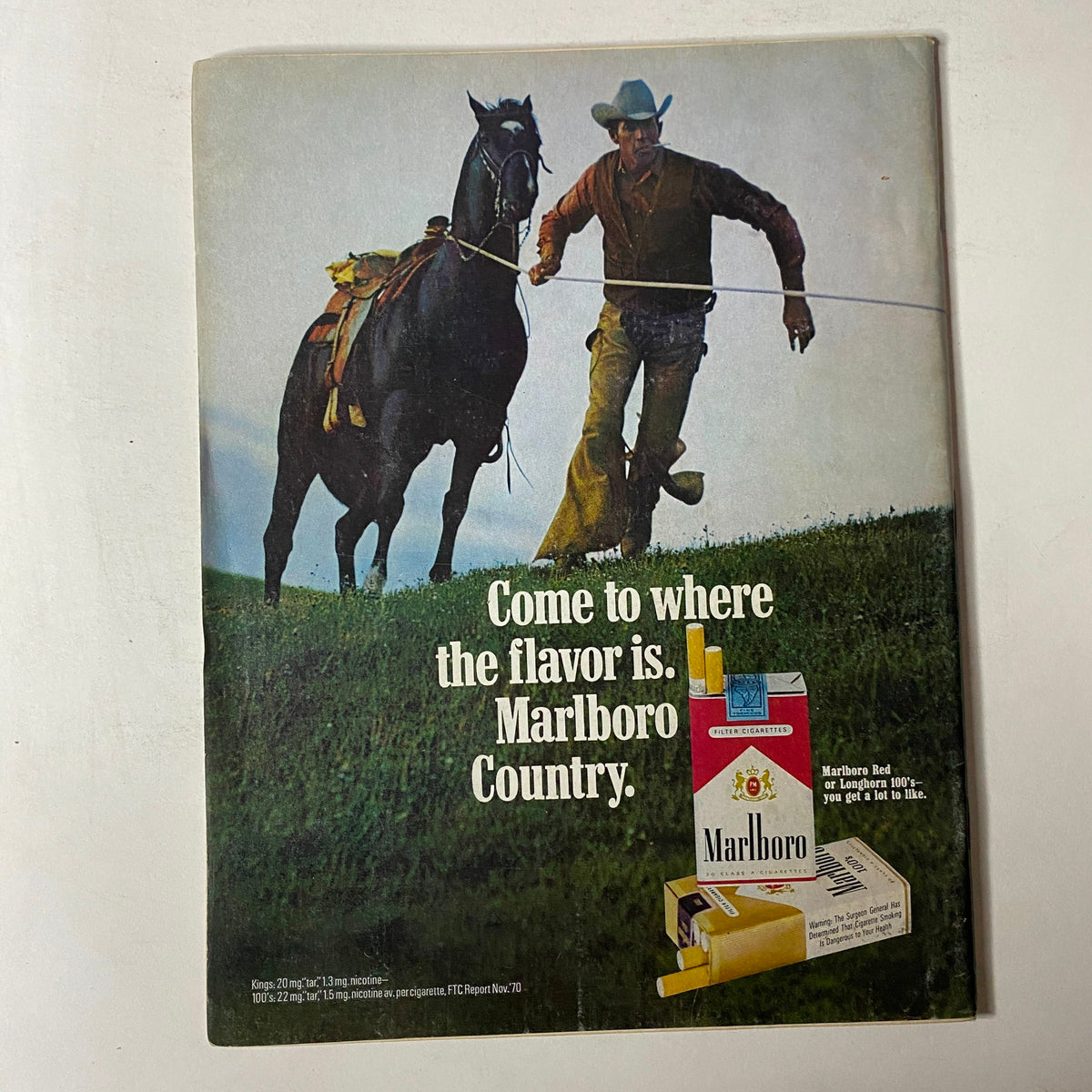 Advertisement in Car Craft Magazine, December 1971, featuring a cowboy with a horse promoting Marlboro cigarettes, illustrating classic Americana.