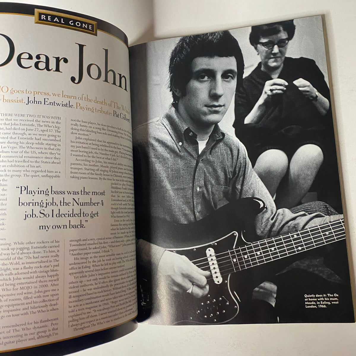 A feature article in Mojo The Music Magazine August 2002 with a tribute to John Entwistle, The Who's bassist, accompanied by a photo of him and a woman.