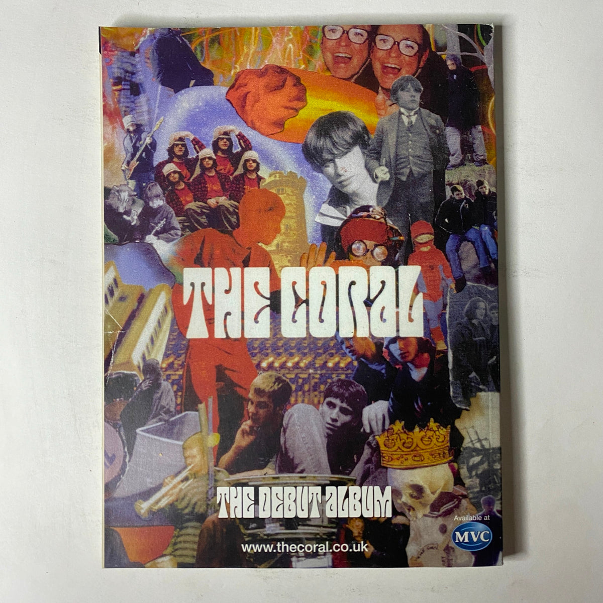 Promotional brochure for The Coral's debut album, displayed alongside Mojo The Music Magazine August 2002, emphasizing the connection between music publications and artists.