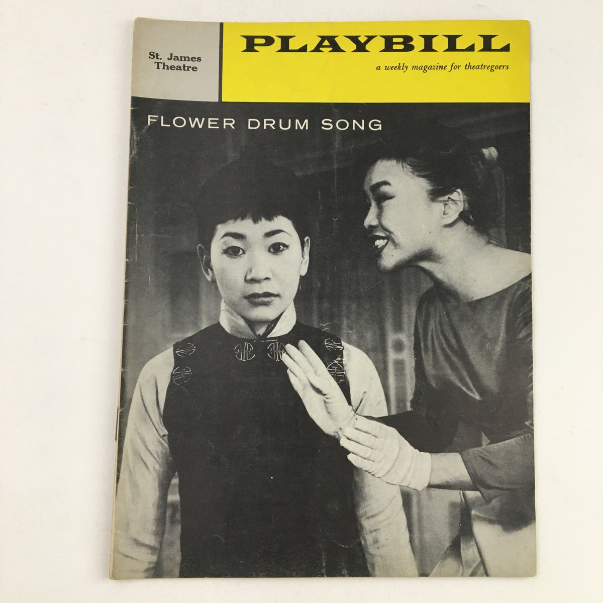 1959 Playbill for Flower Drum Song at St. James Theatre featuring a dramatic image of two characters, showcasing the iconic production directed by Gene Kelly.