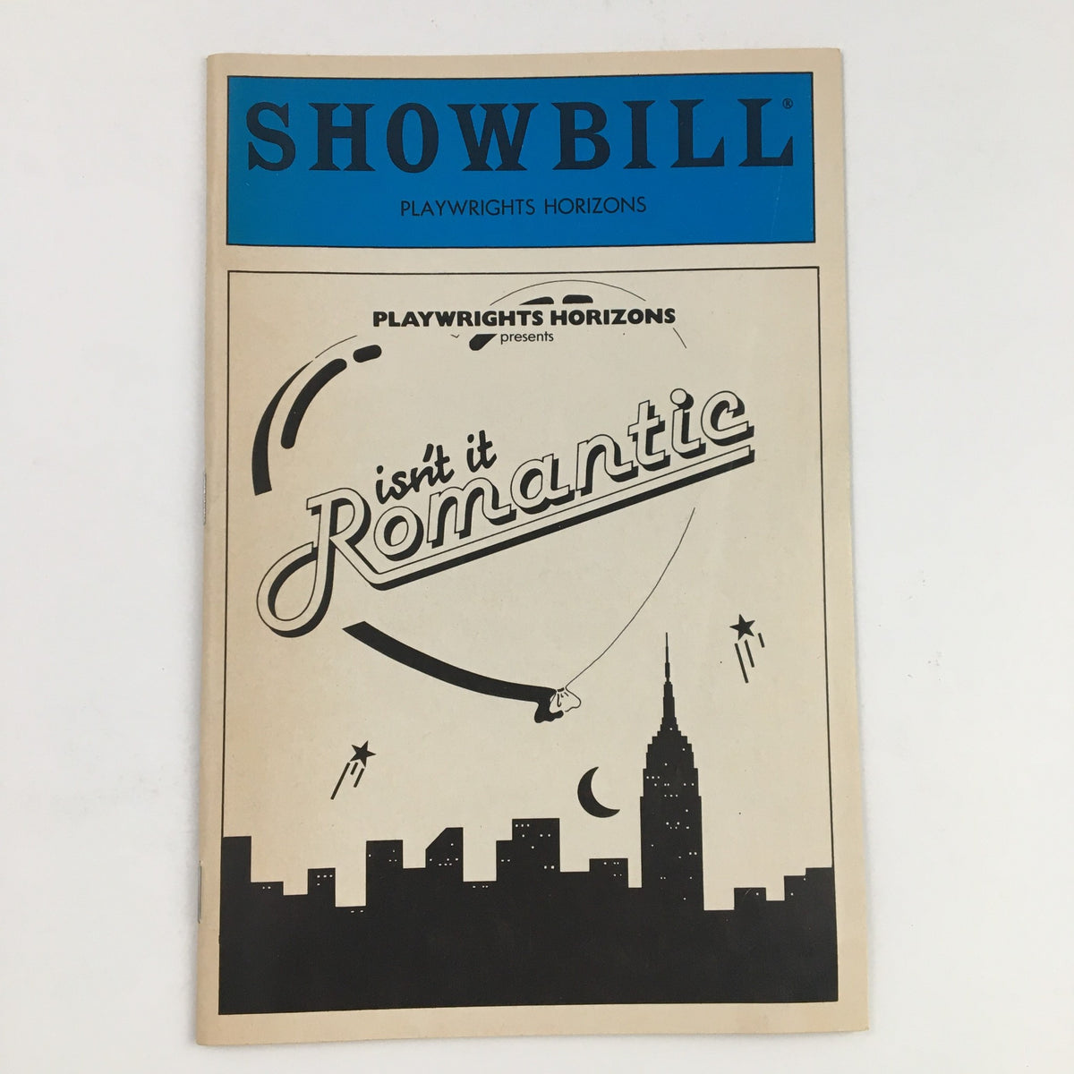 1984 Showbill for 'Isn't It Romantic' by Wendy Wasserstein, presented by Playwrights Horizons, featuring a design with the city skyline and artistic title.