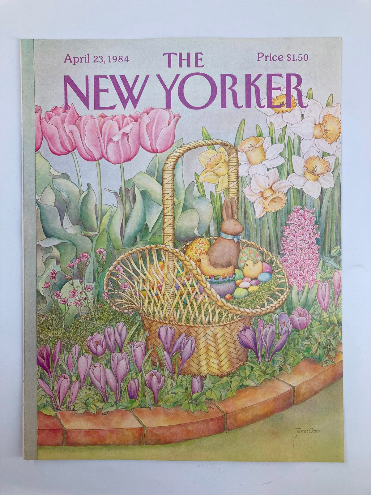 COVER ONLY The New Yorker April 23 1984 Easter Bunny Basket by Jenni Oliver, showcasing an artistic depiction of an Easter basket amidst blooming tulips and daffodils, capturing the festive spirit of spring.