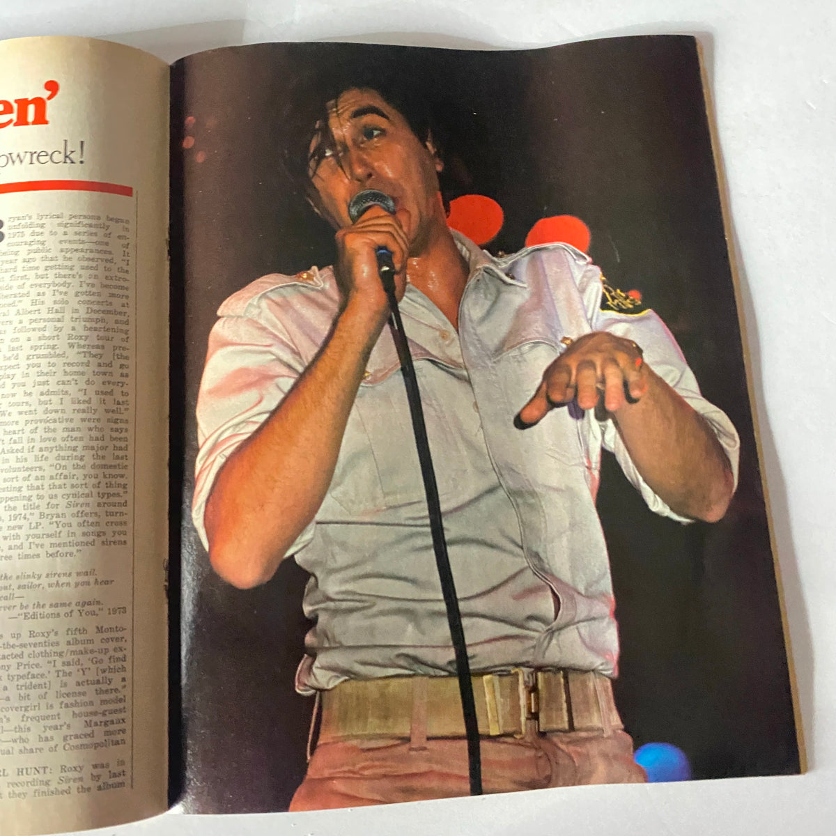 Image from VTG Circus Magazine March 2 1976 featuring a live performance shot of an unidentified male singer, showcasing the vibrant music scene of the 1970s.