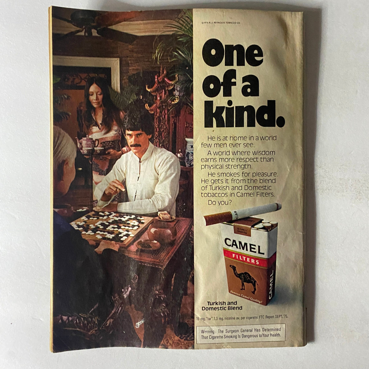 Crawdaddy Magazine August 1976 advertisement page, showcasing Camel Filters cigarettes, highlighting their Turkish and Domestic Blend tobacco, set in an elegant sitting room.