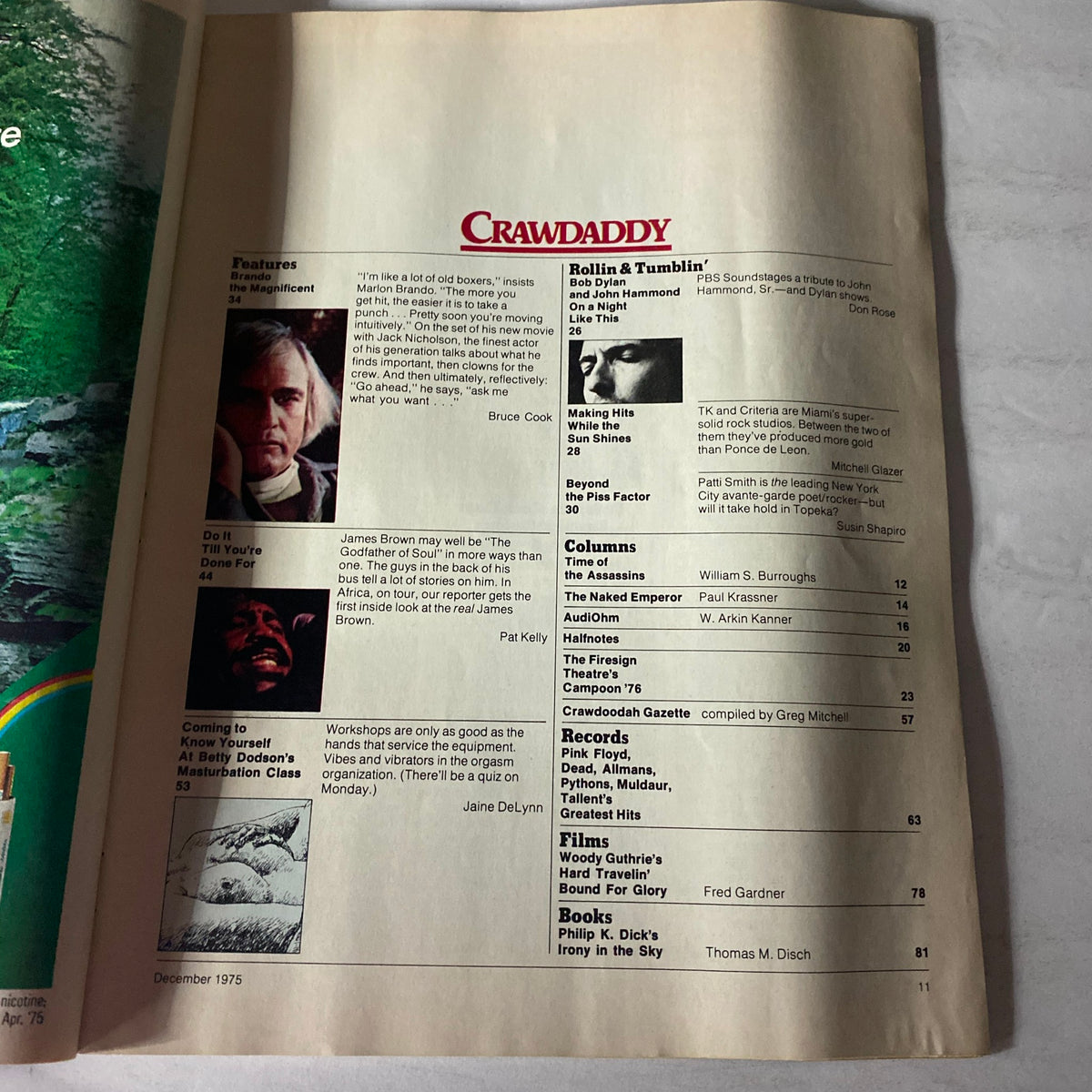 Crawdaddy Magazine December 1975 features section with articles on James Brown and Marlon Brando, showcasing the vibrant cultural scene of the 1970s.