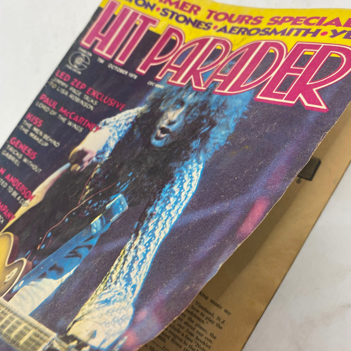 Close-up angle of the VTG Hit Parader Magazine October 1976, emphasizing the detailed cover art featuring Led Zeppelin and Paul McCartney, indicative of the rock culture from the mid-1970s.