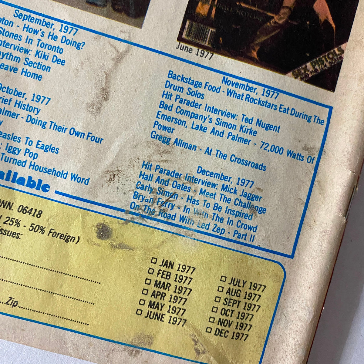 Close-up of the back cover of Hit Parader Magazine showcasing a detailed list of past edition features and advertisements, highlighting popular rock artists. VTG Hit Parader Magazine May 1978 Kiss To The Rescue w Poster.