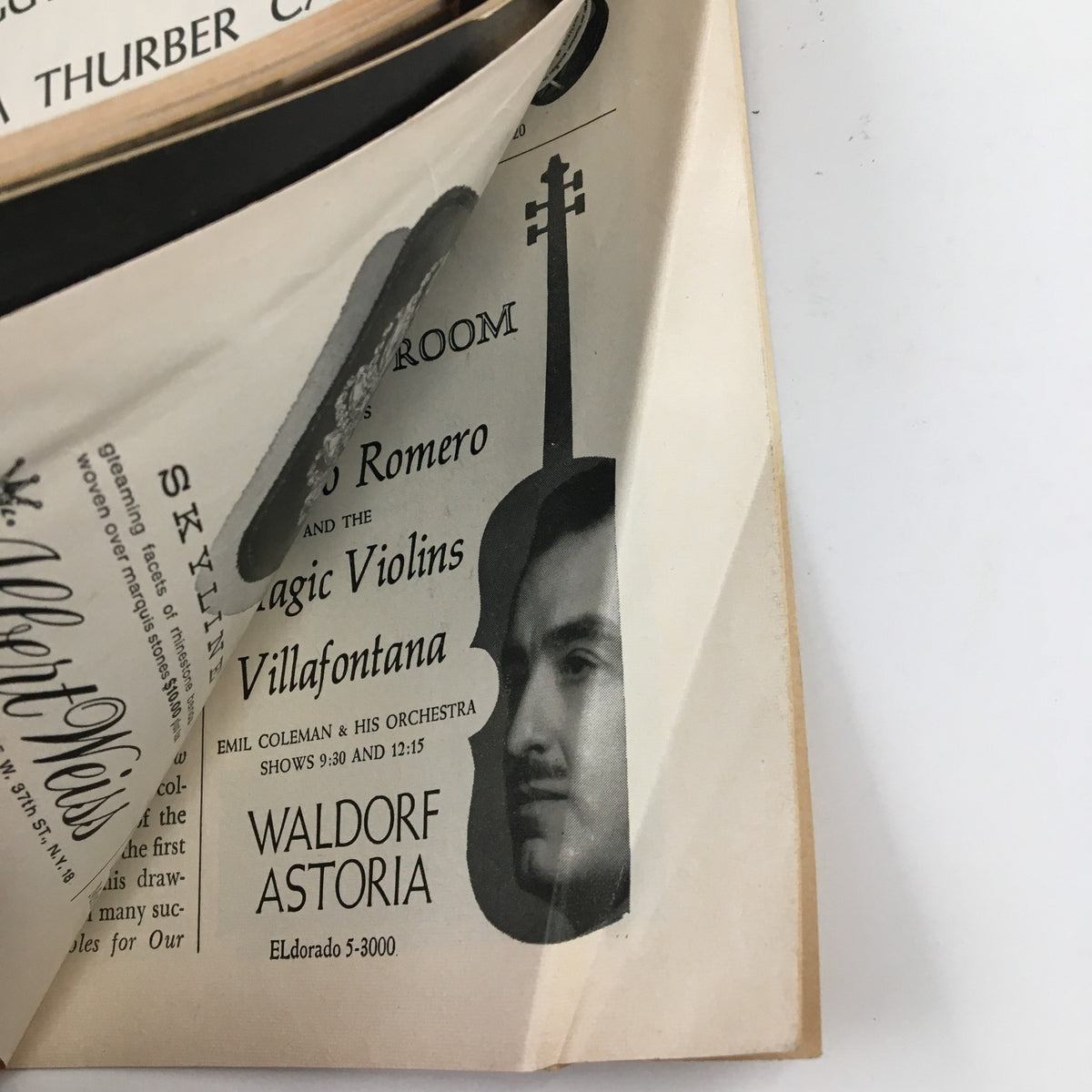 Interior page from the 1960 Playbill for A Thurber Carnival displaying advertisements, including one for a violin performance at Waldorf Astoria.