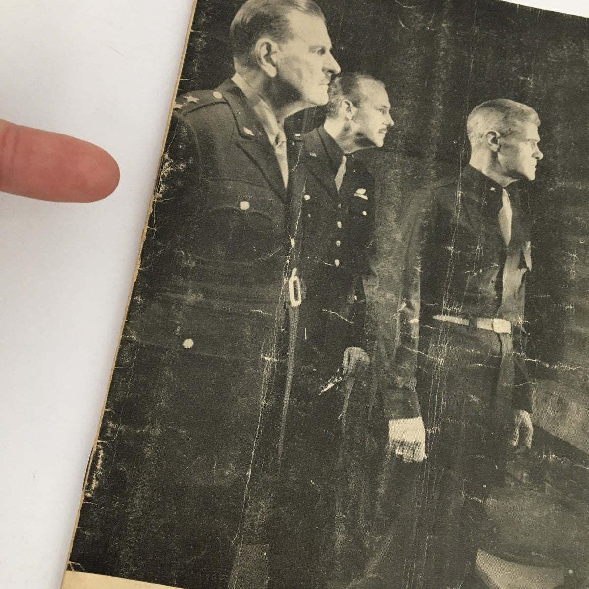 Close-up of the 1948 Playbill for Fulton Theatre's Command Decision showcasing details of the cover with three military figures, indicative of the dramatic themes of the play.