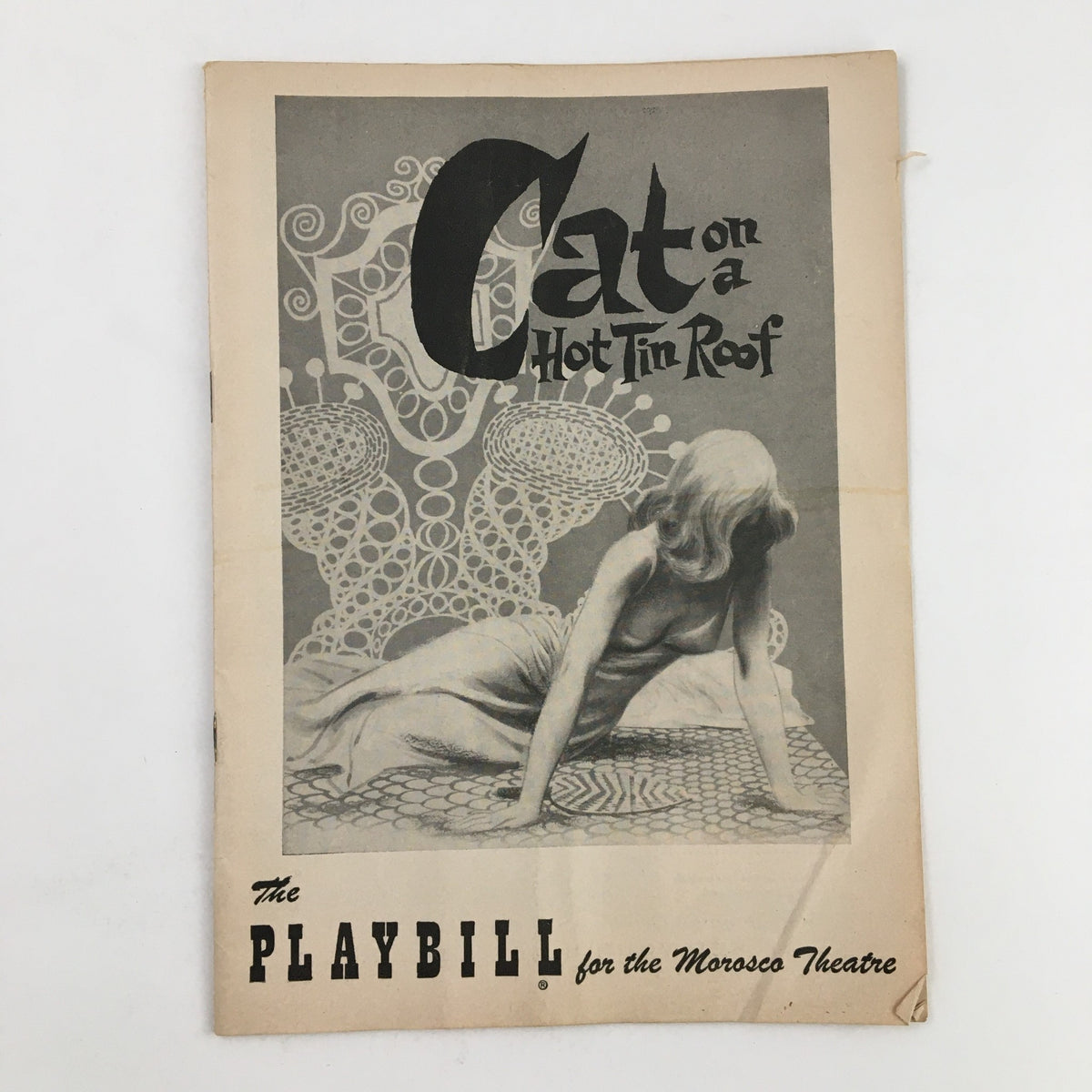 Vintage 1955 Playbill for 'Cat On A Hot Tin Roof' at the Morosco Theatre, showcasing a classic black and white cover design featuring a figure in a dramatic pose.