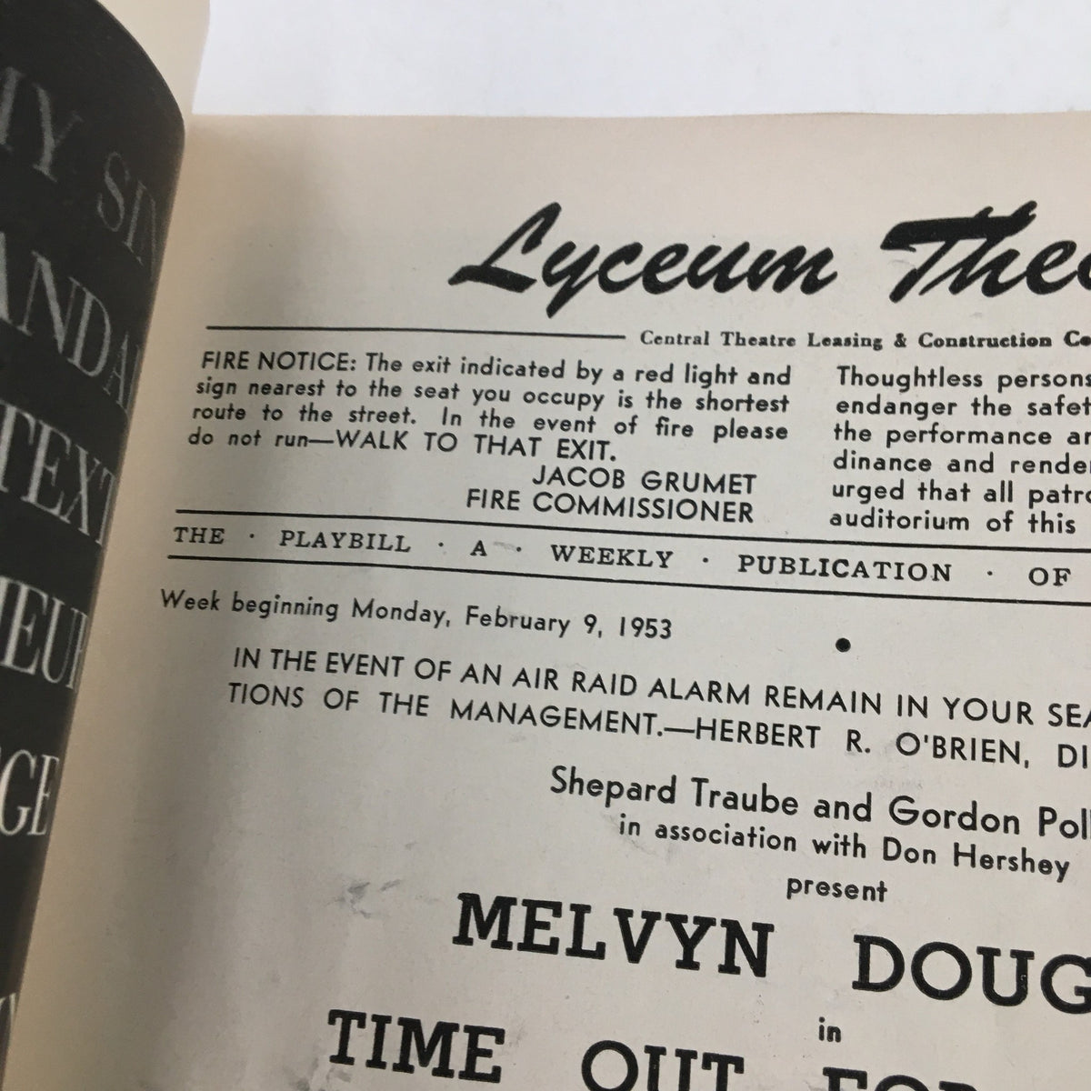 Close-up of an inside page of the 1953 Playbill for the Lyceum Theatre, detailing a fire safety notice and production credits for 'Time Out For Ginger'.