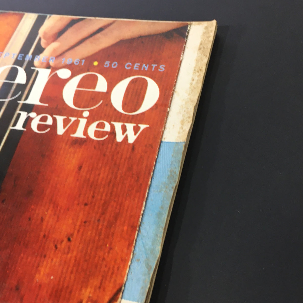 Side view of the vintage VTG HiFi Stereo Review Magazine September 1961, showing the worn edges and retro color scheme, emphasizing its collectible nature.