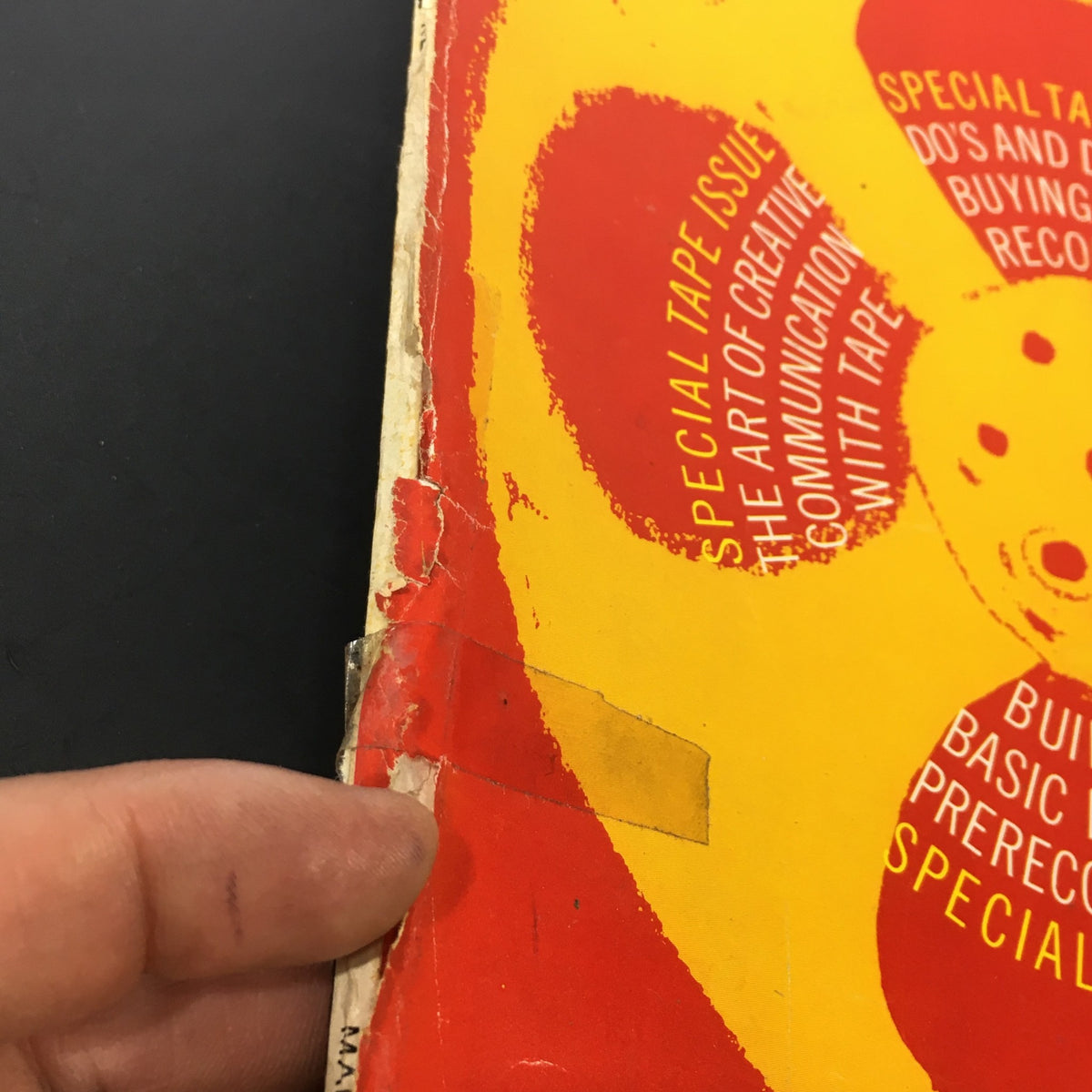 Close-up of the edge of the Vintage HiFi Stereo Review Magazine March 1962, showing wear and a small address label for authenticity.