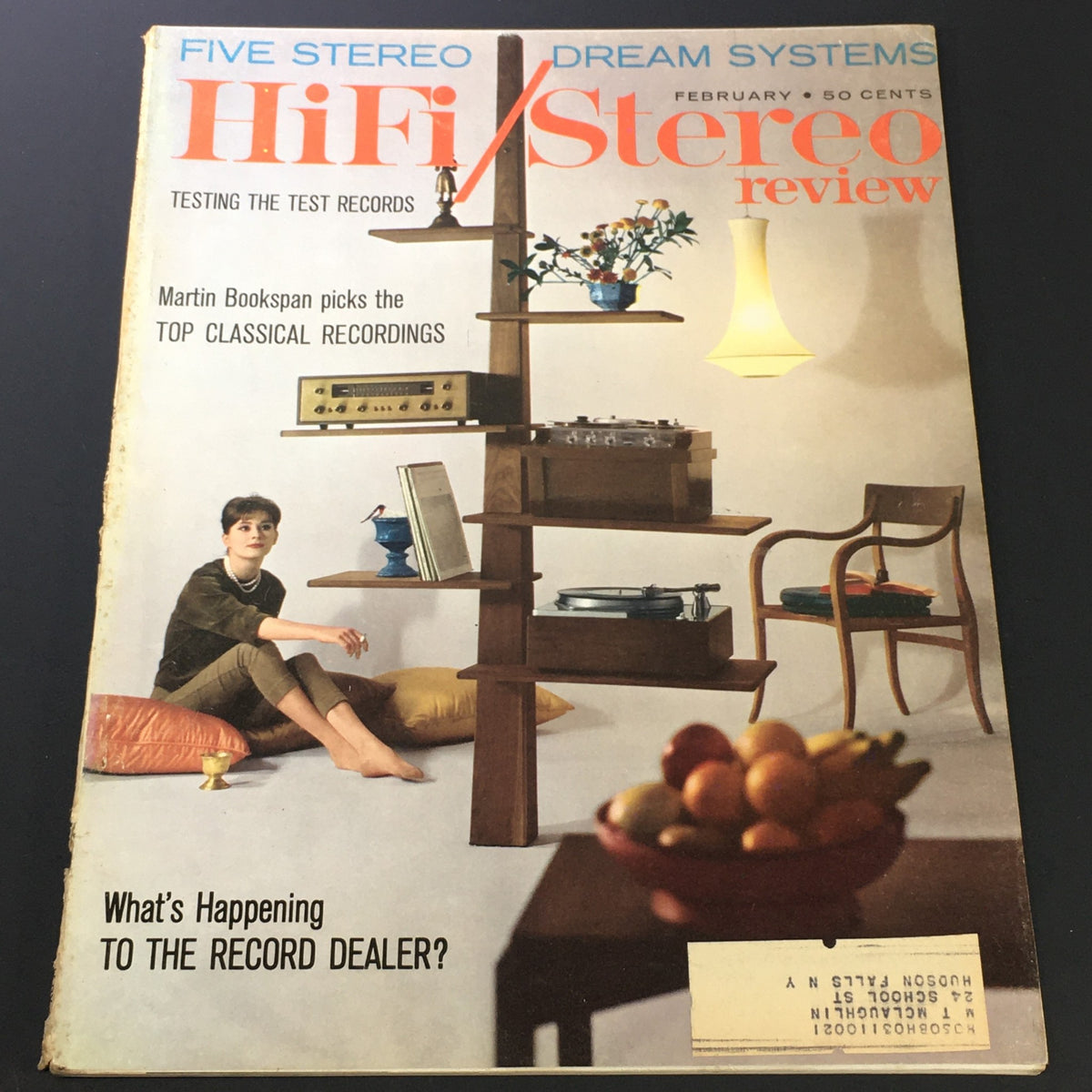 Cover of the Vintage HiFi Stereo Review Magazine - February 1961 featuring Martin Bookspan's top classical recordings, showcasing a young person seated with a stereo setup and asking about the record dealer's future.