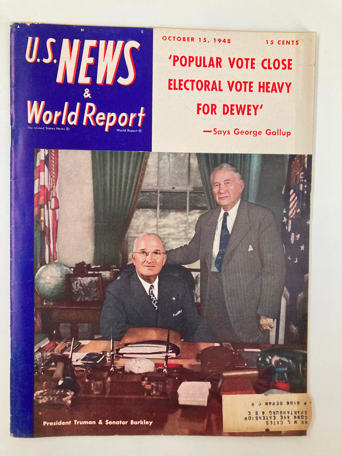 Cover of US News & World Report Magazine dated October 15, 1948, featuring President Harry Truman and Senator Alben W. Barkley in an office setting, highlighting the historical political context of post-war America.