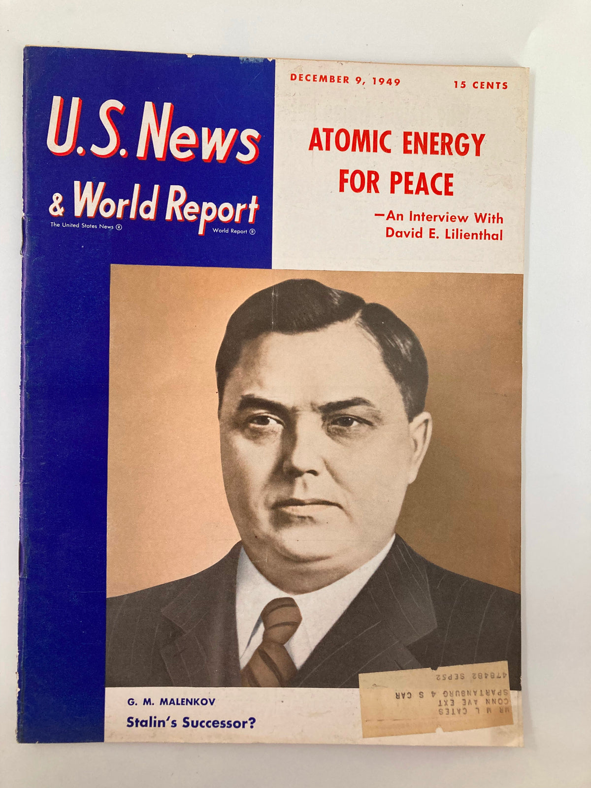 Cover of US News & World Report Magazine dated December 9, 1949, featuring the title 'Atomic Energy for Peace' and an interview with David E. Lilienthal. The cover includes a portrait of G. M. Malenkov, noted as 'Stalin's Successor.', highlighting historical discussions on atomic energy.