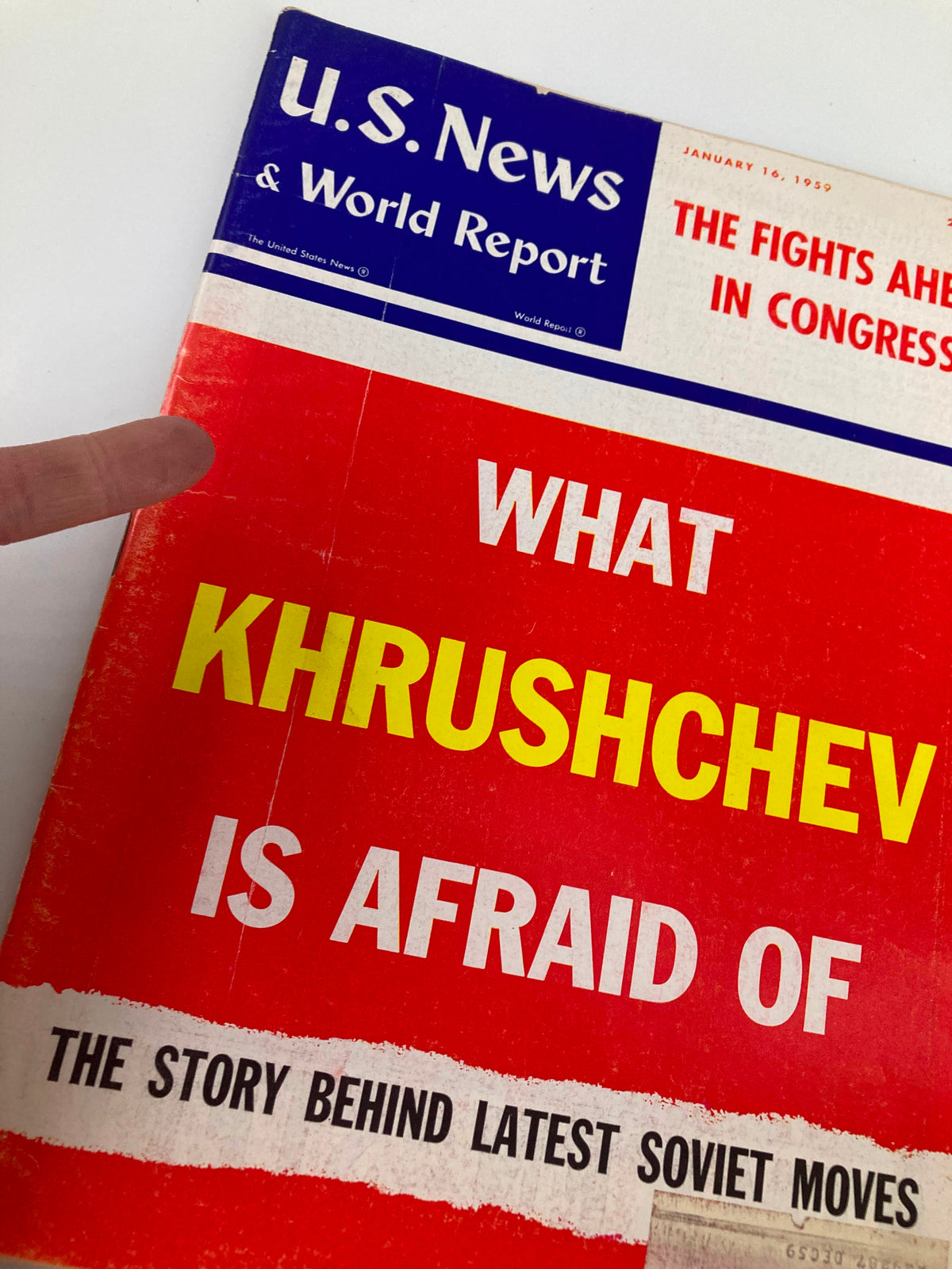 Close-up of the cover of US News & World Report Magazine from January 16, 1959. Highlights the title 'What Khrushchev is Afraid Of' and discusses the story behind latest Soviet moves.