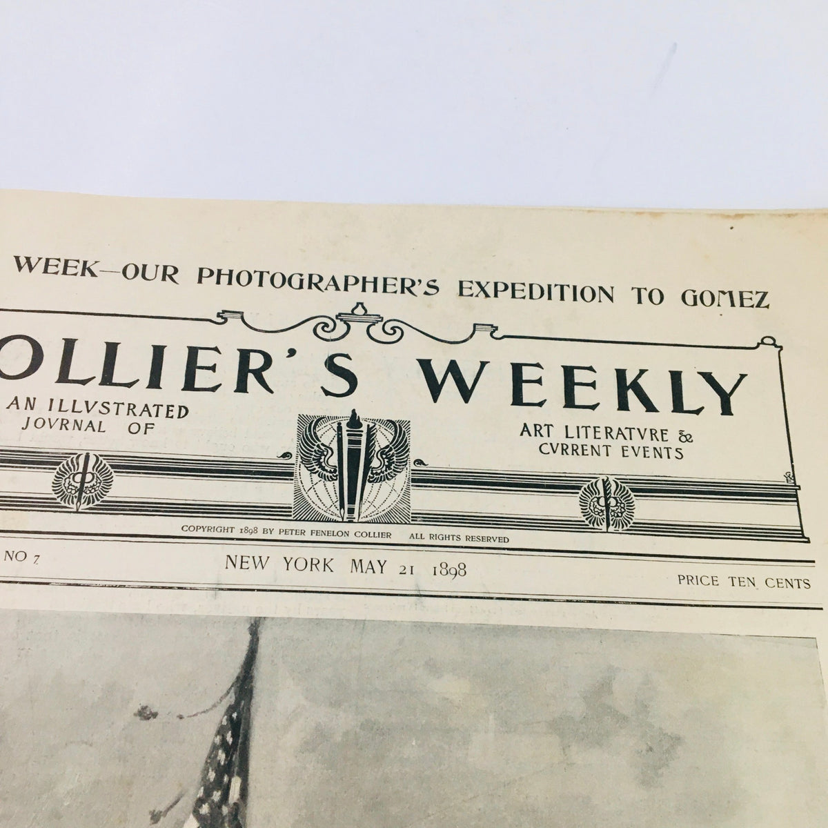 Top section of the Collier's Weekly May 21, 1898 front cover, displaying the title and date, featuring an illustration connected to the American Victory at Manila.
