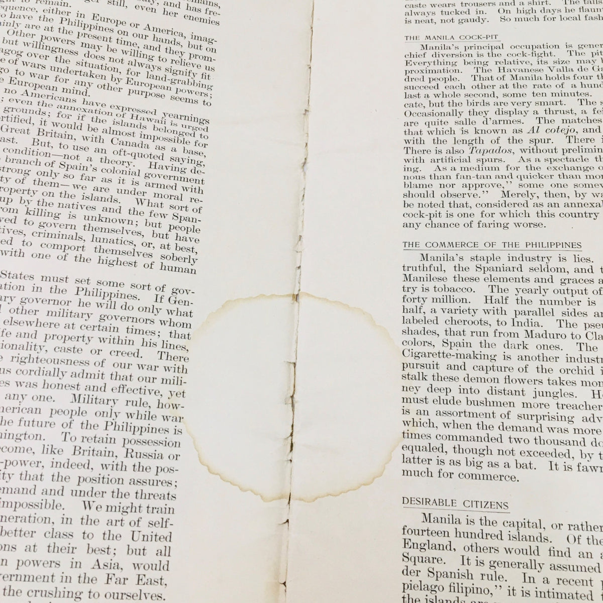 Interior page of Collier's Weekly May 21 1898 Vol 21 #7 showing worn paper with a circular stain, highlighting the historical context of the American Victory at Manila.