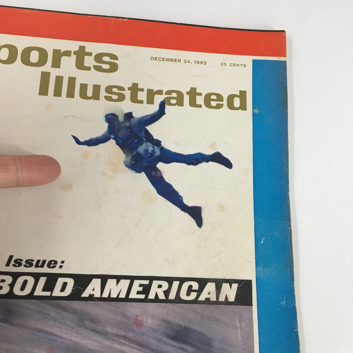 Close-up view of the front cover of the Sports Illustrated Magazine December 24, 1962, showcasing the title 'The Bold American Issue' and a skiing athlete mid-air.