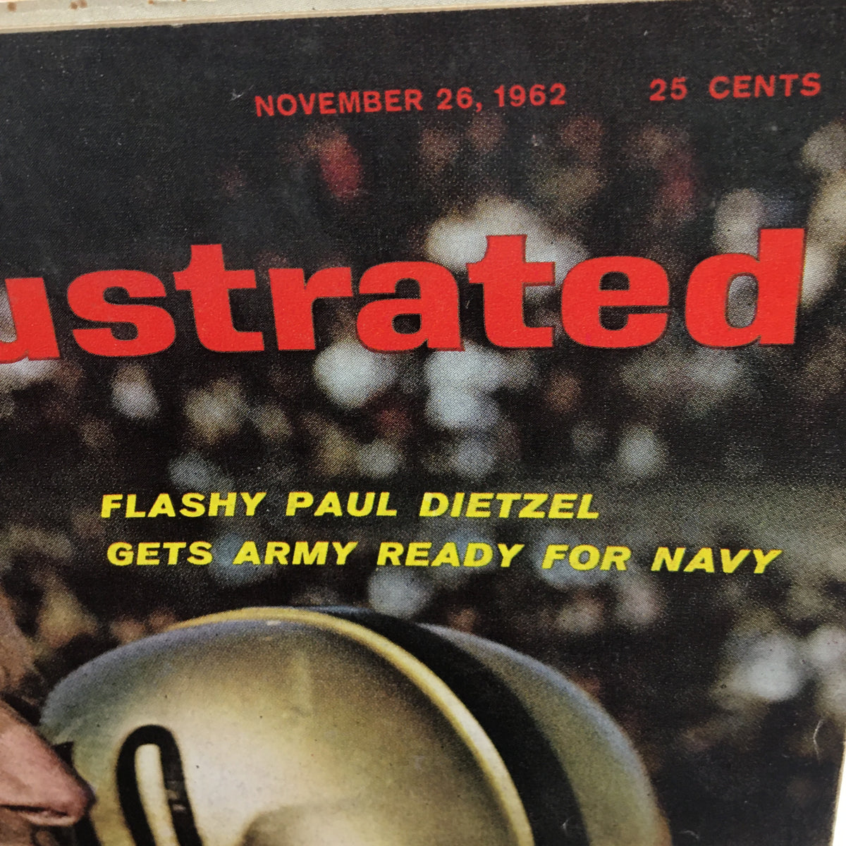 Close-up of the title and headline on Sports Illustrated Magazine from November 26, 1962, reading 'Flashy Paul Dietzel Gets Army Ready for Navy', highlighting its historical significance in sports.
