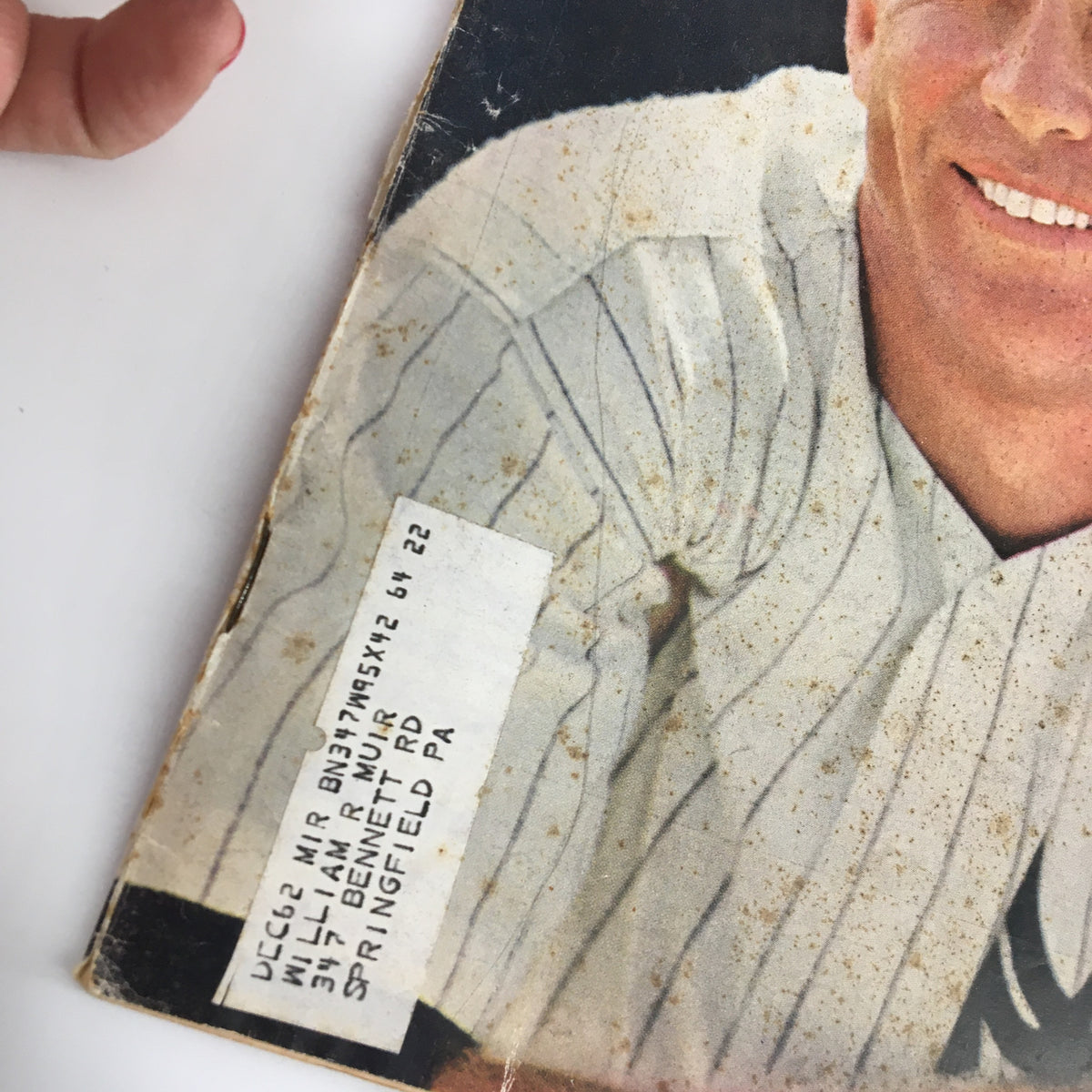 Detail of the back cover of the July 2, 1962 Sports Illustrated magazine featuring Mickey Mantle, showing a label and signs of age. The magazine is a collectible piece of baseball history.