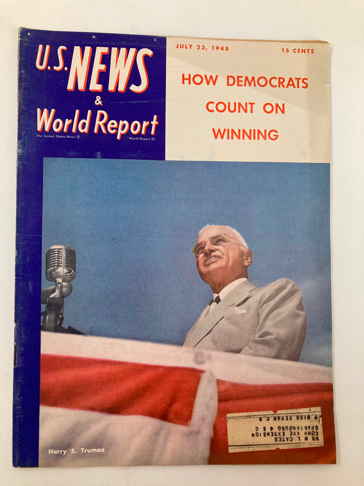 Cover of US News & World Report Magazine, July 23, 1948, featuring President Harry S. Truman speaking at a podium with an American flag. The title highlights how Democrats count on winning.