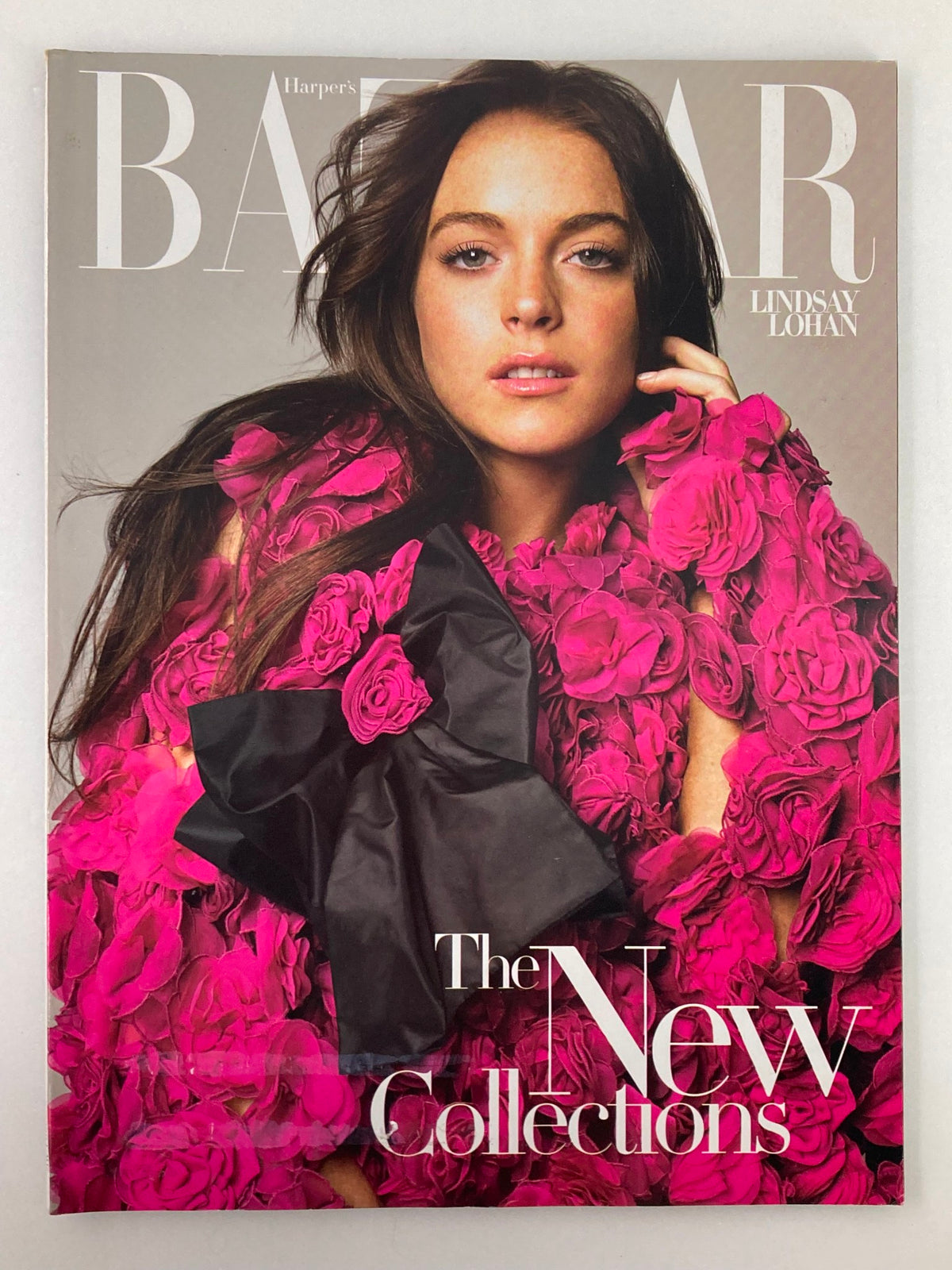 Cover of Harper's Bazaar Magazine July 2006 featuring Lindsay Lohan, showcasing 'The New Collections' in vibrant pink floral attire.
