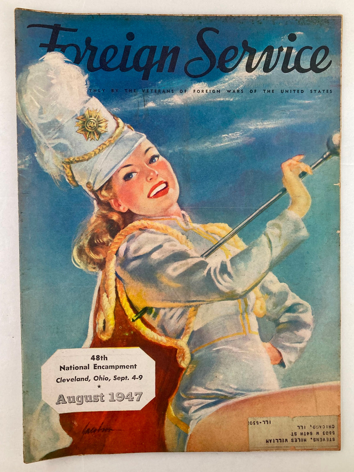 Front cover of VTG Foreign Service Magazine from August 1947, Vol 34 #12, featuring vibrant illustration of a woman in a parade uniform with a scenic blue background and text about the 48th National Encampment.