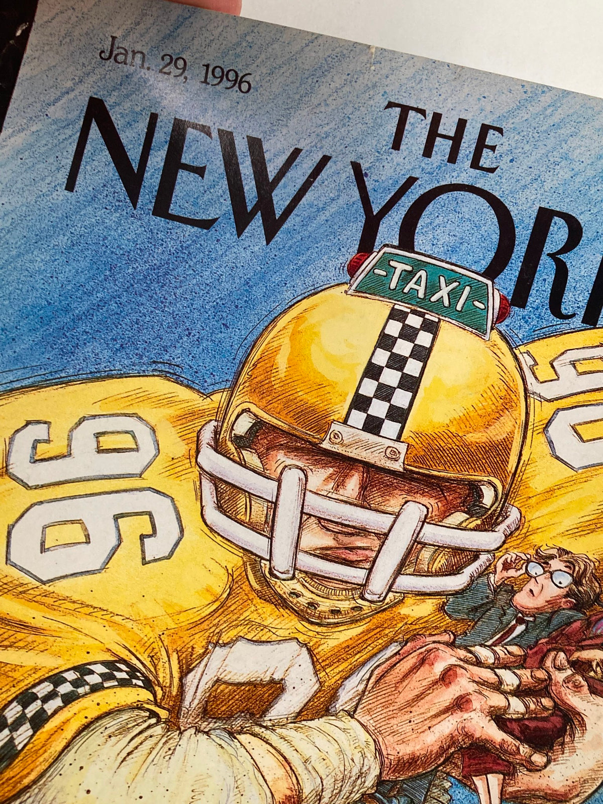 Close-up view of The New Yorker magazine cover from January 29, 1996, showcasing George Riemann's artwork with an emphasis on a character in a yellow taxi helmet and the intricate details of the illustration.
