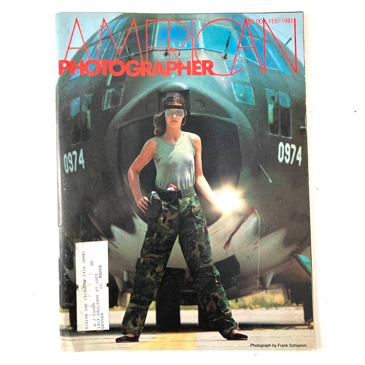 Cover of American Photographer Magazine February 1981 featuring model Marie Helene Bourgoignie in front of an aircraft, showcasing 1980s fashion photography.