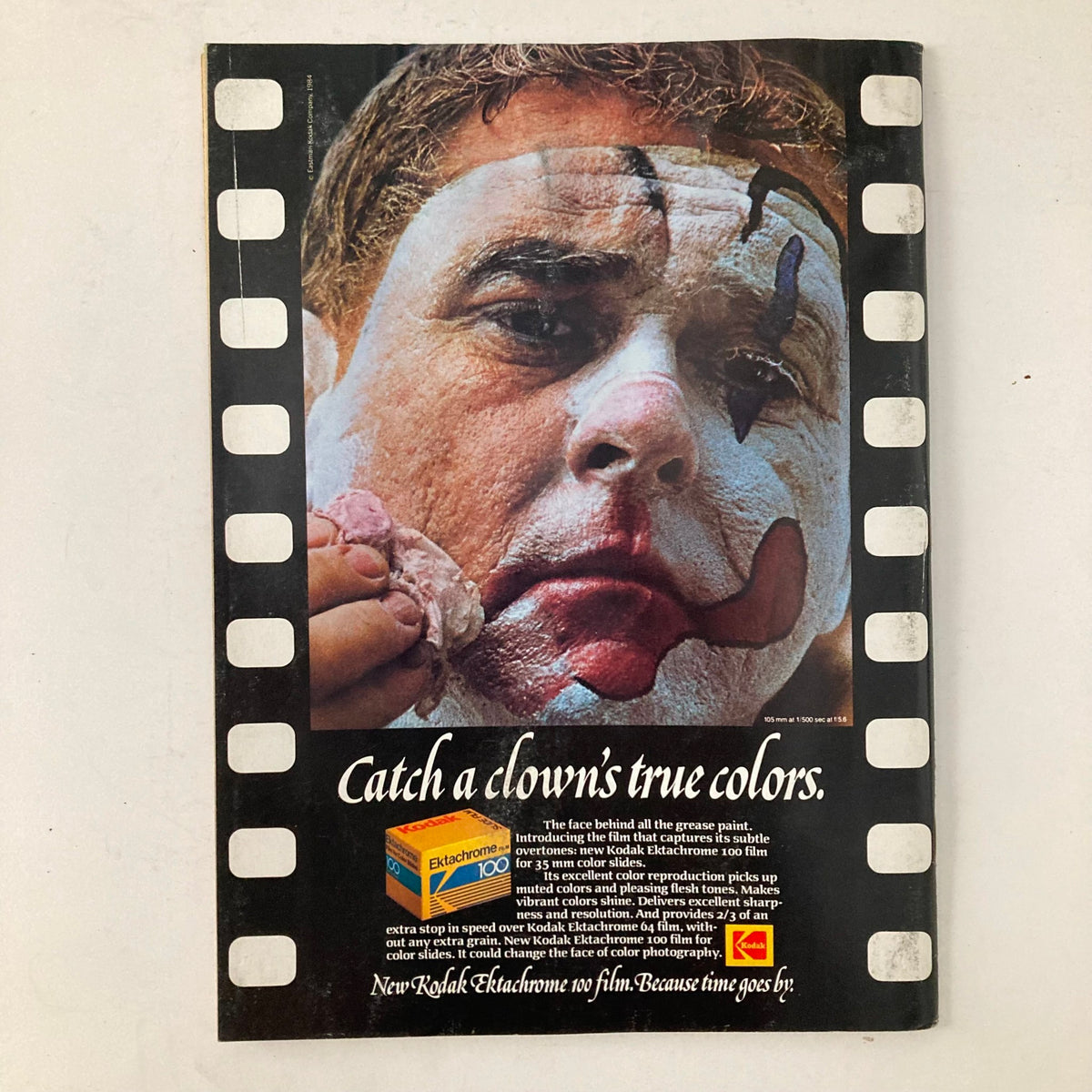 Back cover of American Photographer Magazine July 1984 with an advertisement for Kodak film, featuring a close-up of a clown's face being painted.