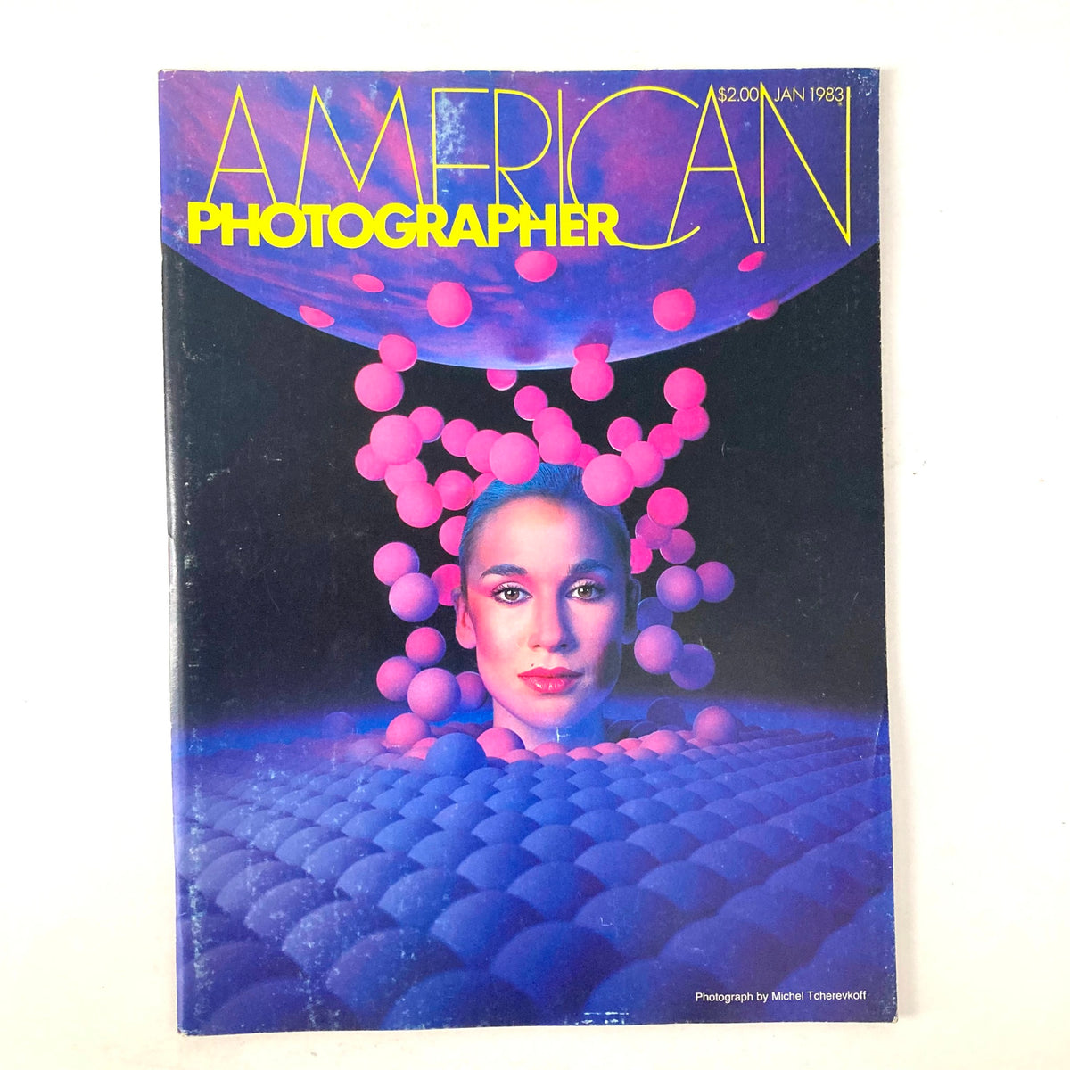 Cover of American Photographer Magazine January 1983 featuring a striking photograph by Michel Tcherkoff, showcasing an artistic representation with vibrant colors and abstract elements.