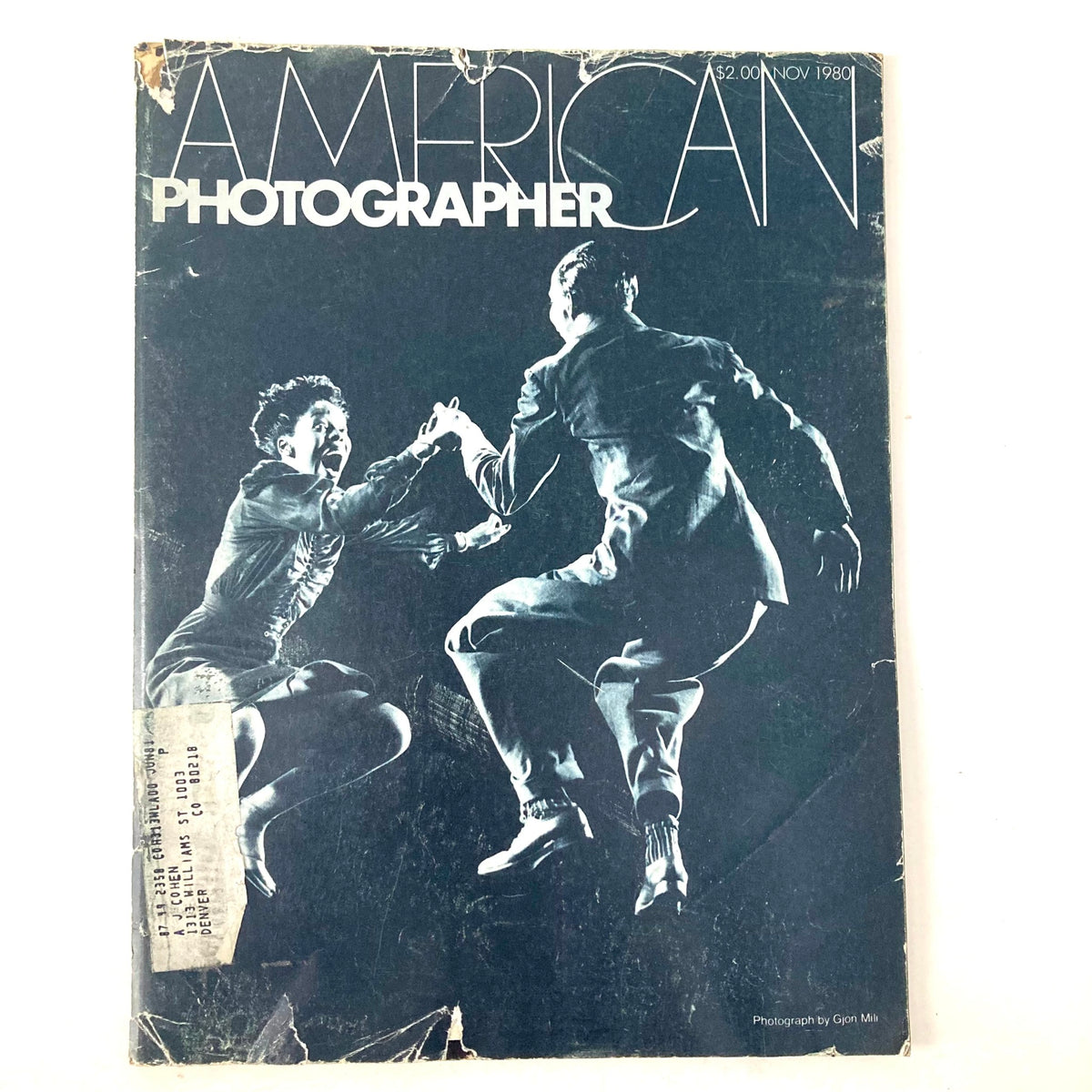 Cover of the American Photographer Magazine from November 1980, showcasing an engaging black and white photograph of two dancers in motion. The magazine features the artwork of renowned photographers Willa Mae Ricker and Leon James, capturing the vibrant essence of photography during that period.