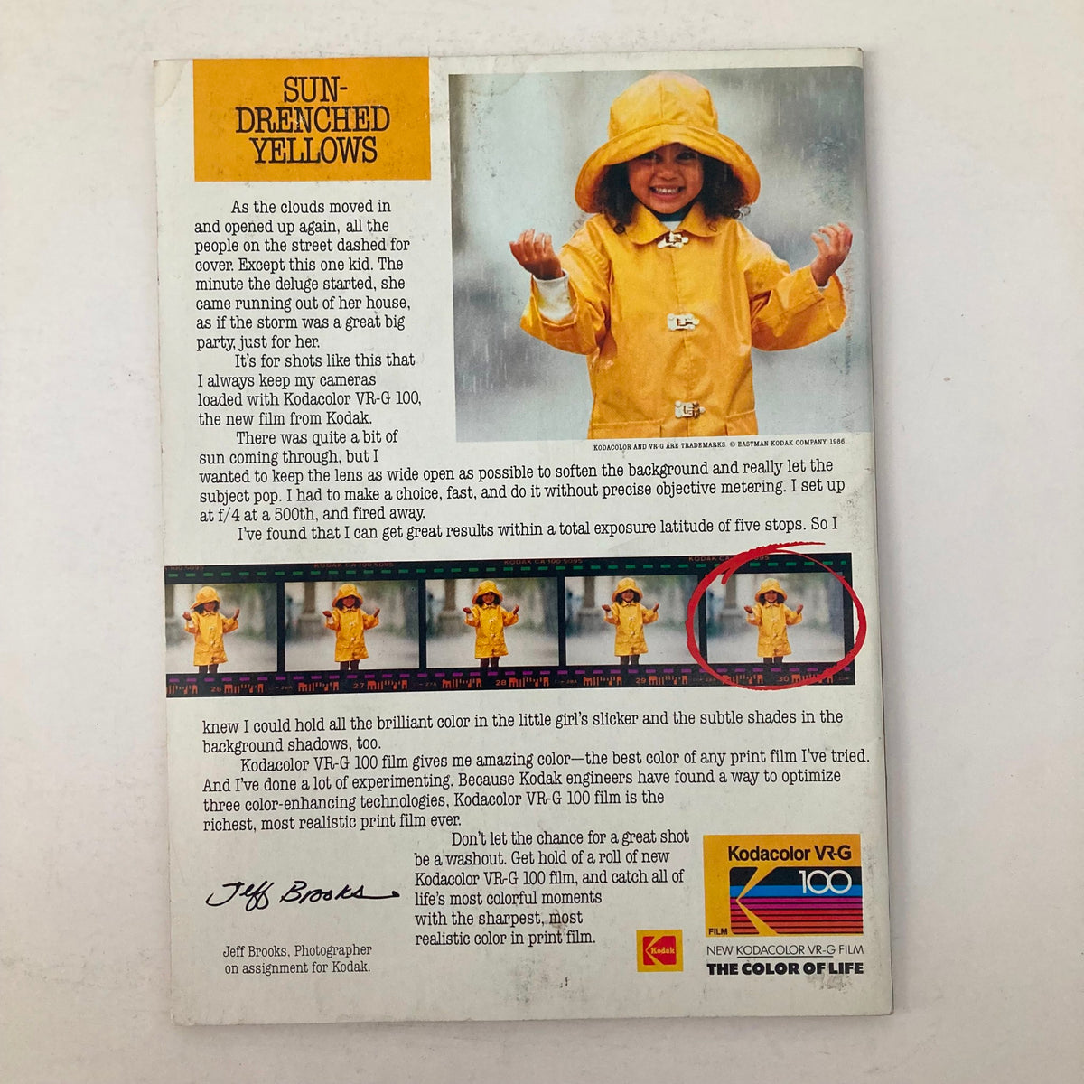 Back cover of American Photographer Magazine September 1986 with an article on photography techniques, featuring a young girl in a yellow raincoat, emphasizing Kodacolor VR-G film.