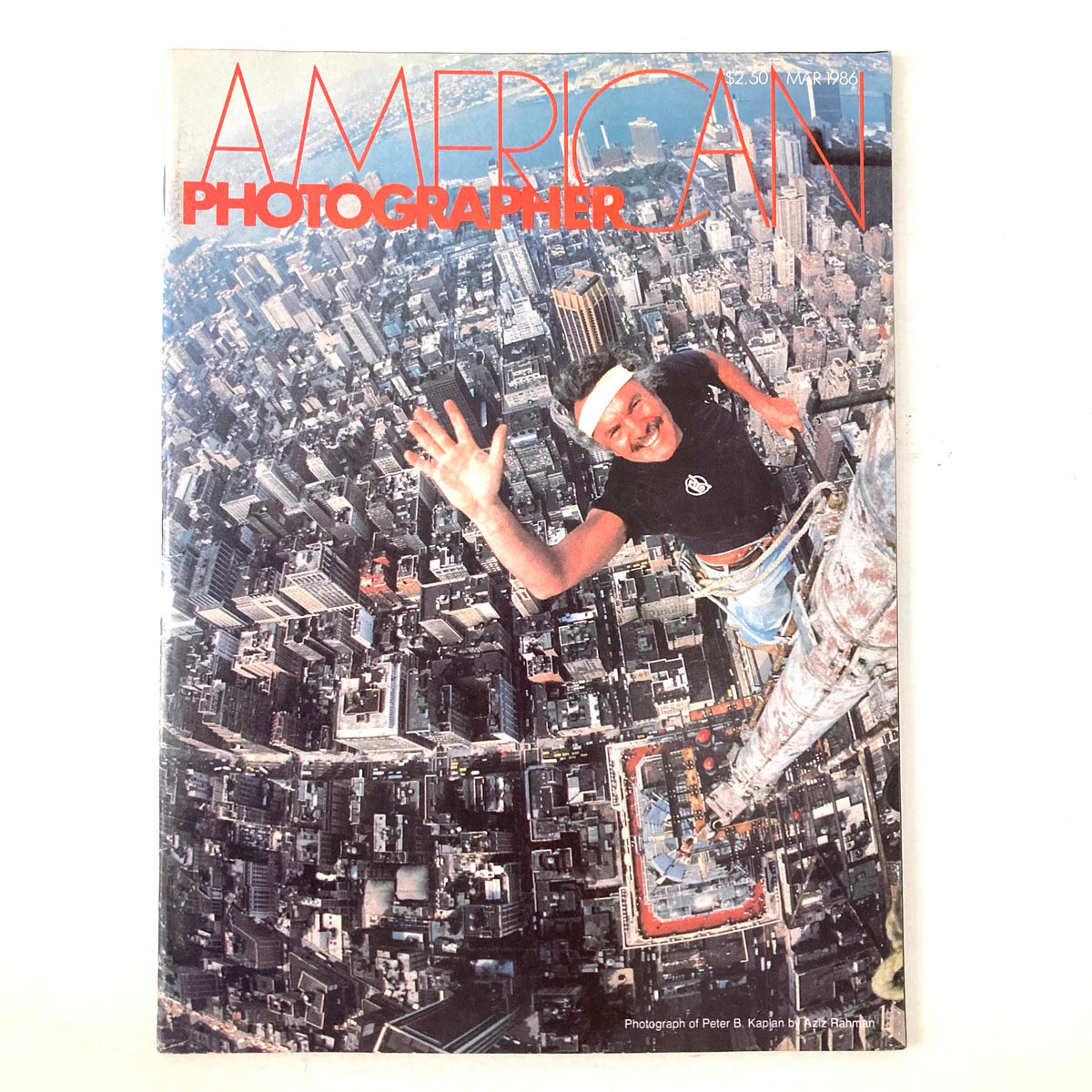 Cover of American Photographer Magazine March 1986 featuring a photograph by Peter B. Kaplan, showcasing an aerial view of a bustling cityscape below.