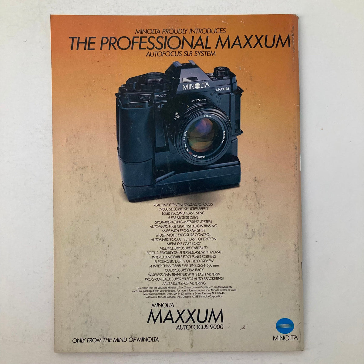 Back cover of American Photographer Magazine April 1986 advertising the Minolta Maxxum autofocus SLR camera system.