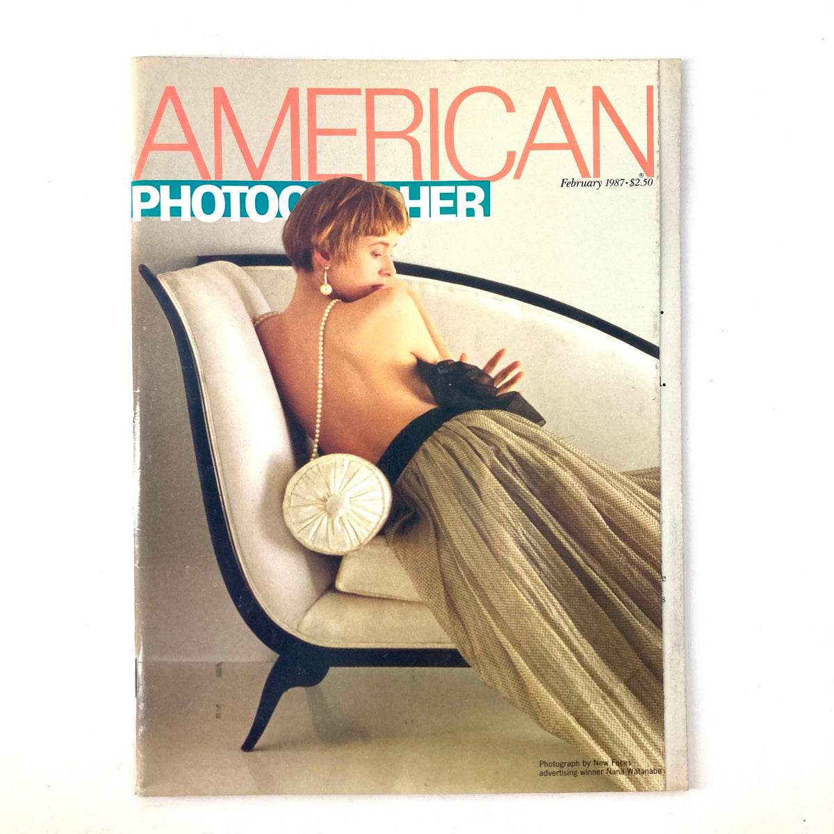 American Photographer Magazine February 1987 Cover by Nana Watanabe featuring a model with a stylish fashion look sitting on a modern chair.