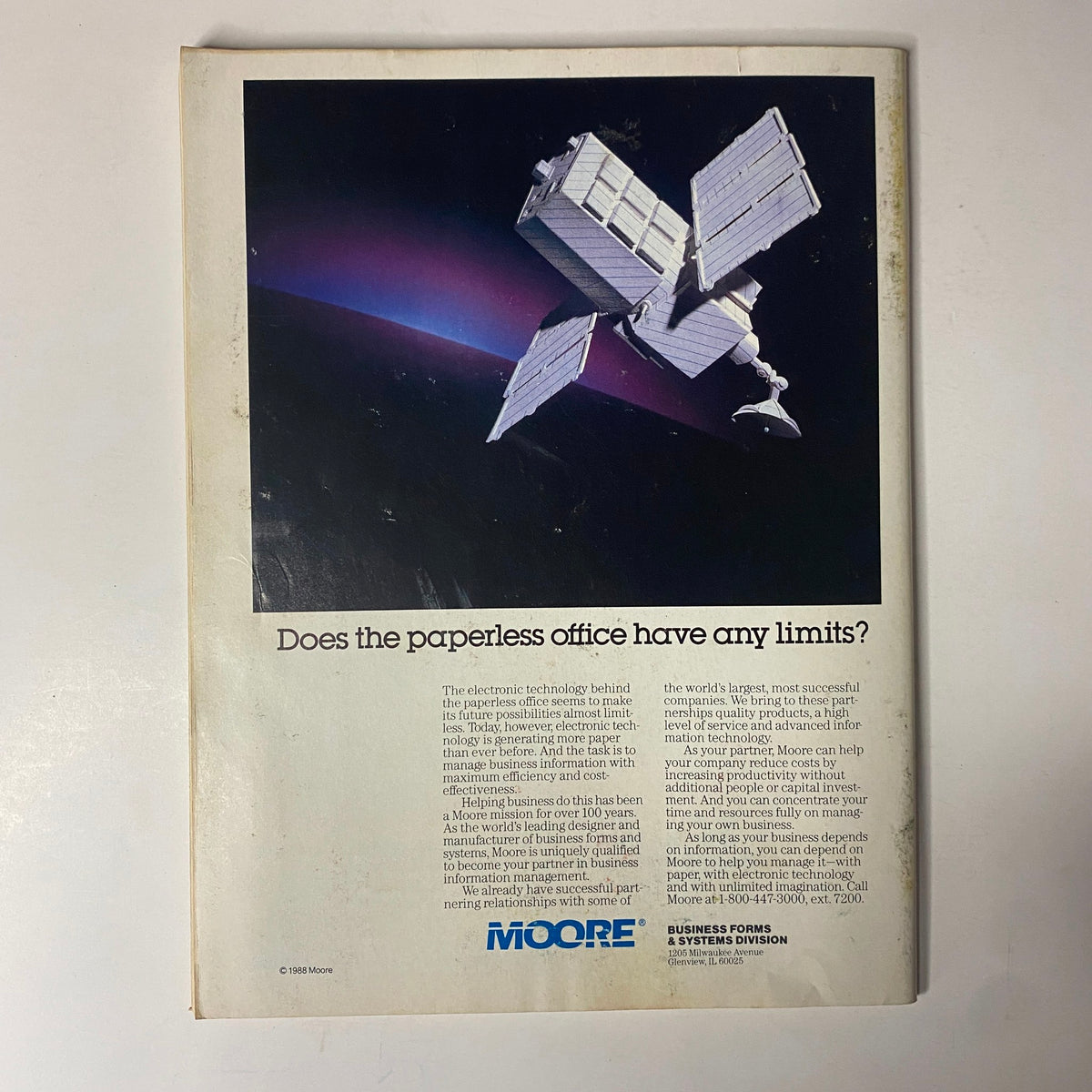 Back cover of Forbes Magazine July 11, 1988, featuring an advertisement discussing the concept of a paperless office, emphasizing modern technology's impact on business efficiency.