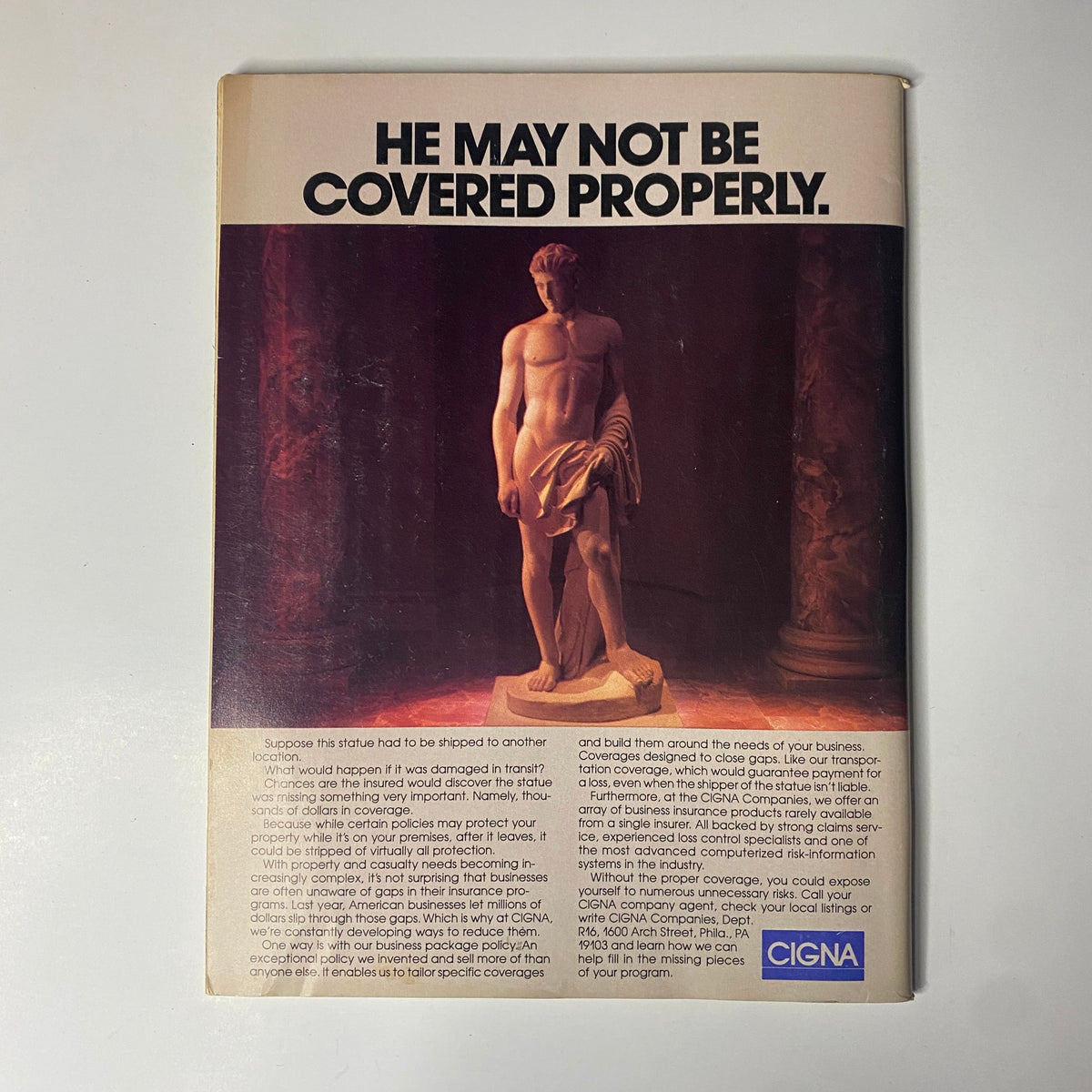 Back cover of Forbes Magazine March 6, 1989 with an advertisement from Cigna Insurance, featuring a sculpture and the text 'He May Not Be Covered Properly'.