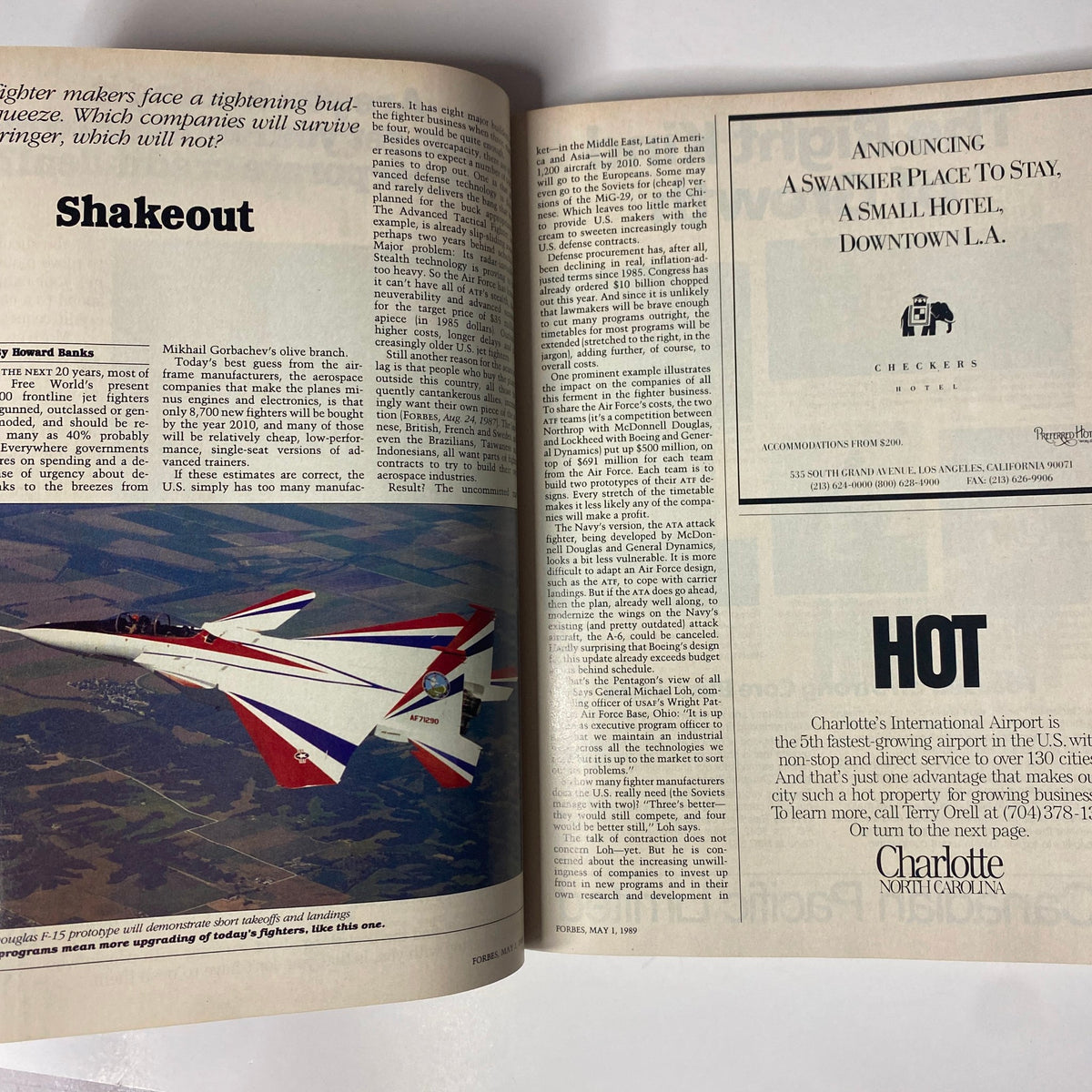 Open spread in Forbes Magazine, May 1, 1989, discussing global aviation dynamics, featuring an F-15 prototype, highlighting defense industry insights.