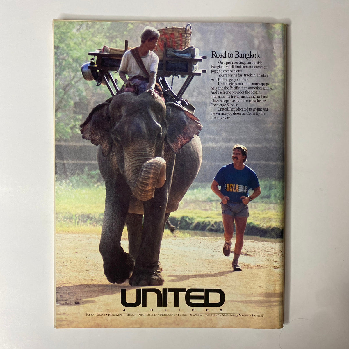 Advertisement in Forbes Magazine June 12, 1989 showcasing United Airlines with an elephant in Bangkok.