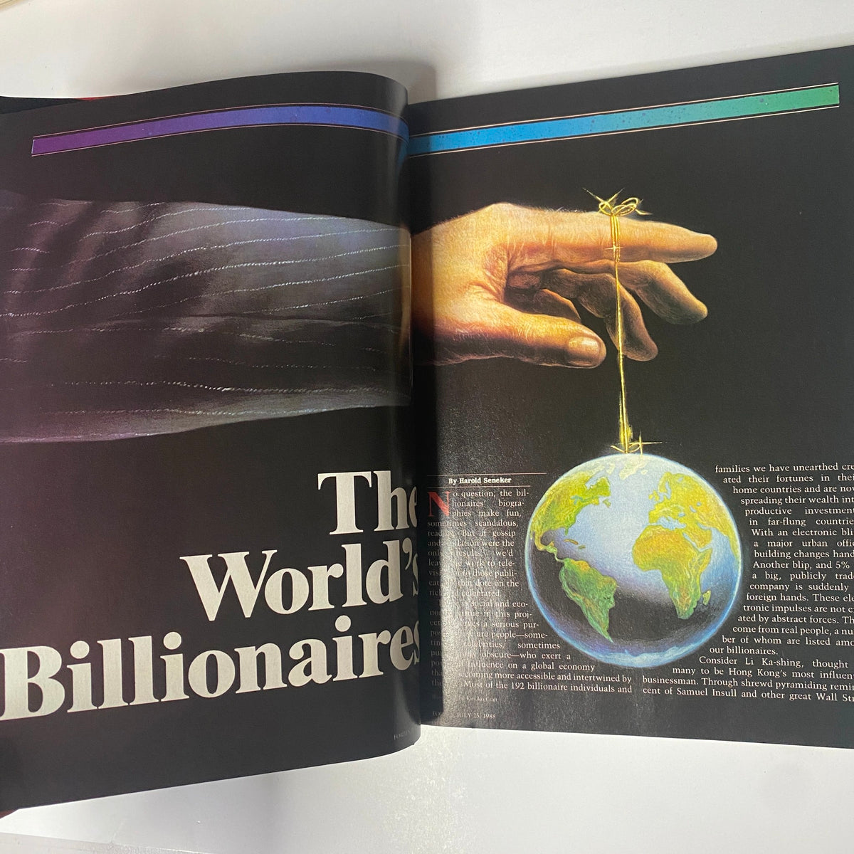 Inside spread of Forbes Magazine, July 25, 1988, featuring the article 'The World's Billionaires' with a visual of a hand holding a globe.
