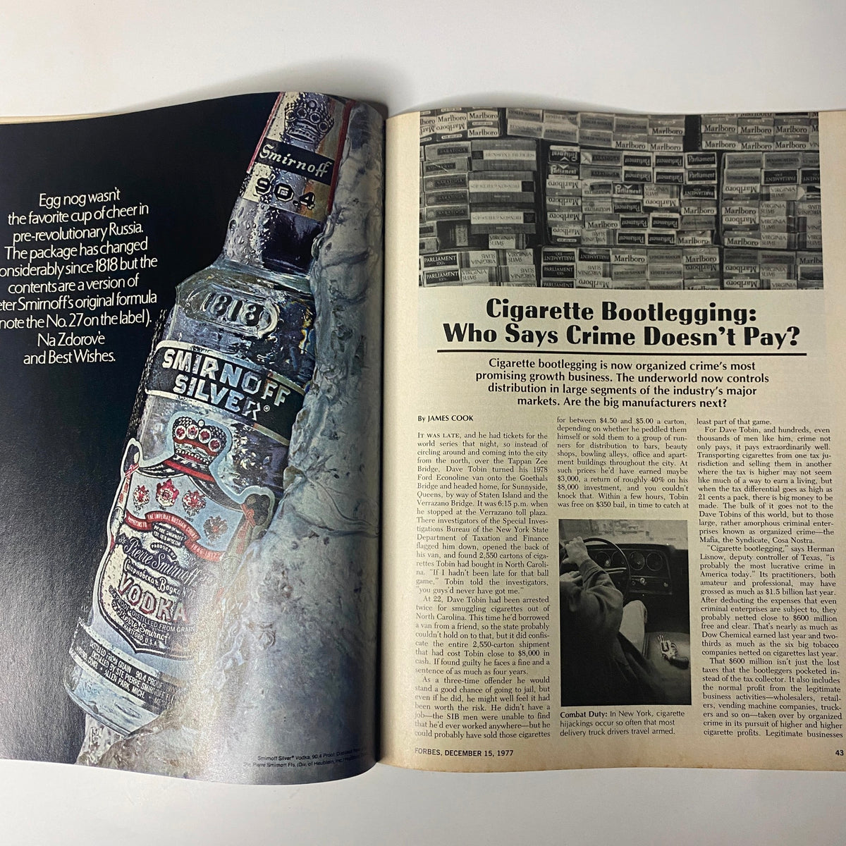 Interior spread of Forbes Magazine December 15, 1977, featuring the article 'Cigarette Bootlegging: Who Says Crime Doesn’t Pay?'. The image includes visuals of cigarette packs and an engaging discussion of bootlegging's influence on the industry.