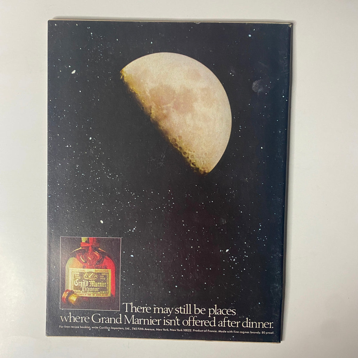Back cover of Forbes Magazine December 15, 1977, showcasing an advertisement for Grand Marnier liqueur against a starry backdrop with a crescent moon. This ad reflects the marketing trends of the late 1970s.