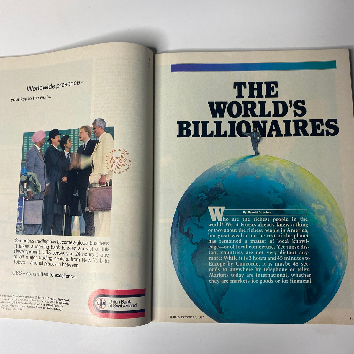 Inside page of Forbes Magazine from October 5, 1987, featuring The World's Billionaires article, displaying an illustration of a globe and a discussion about global wealth.
