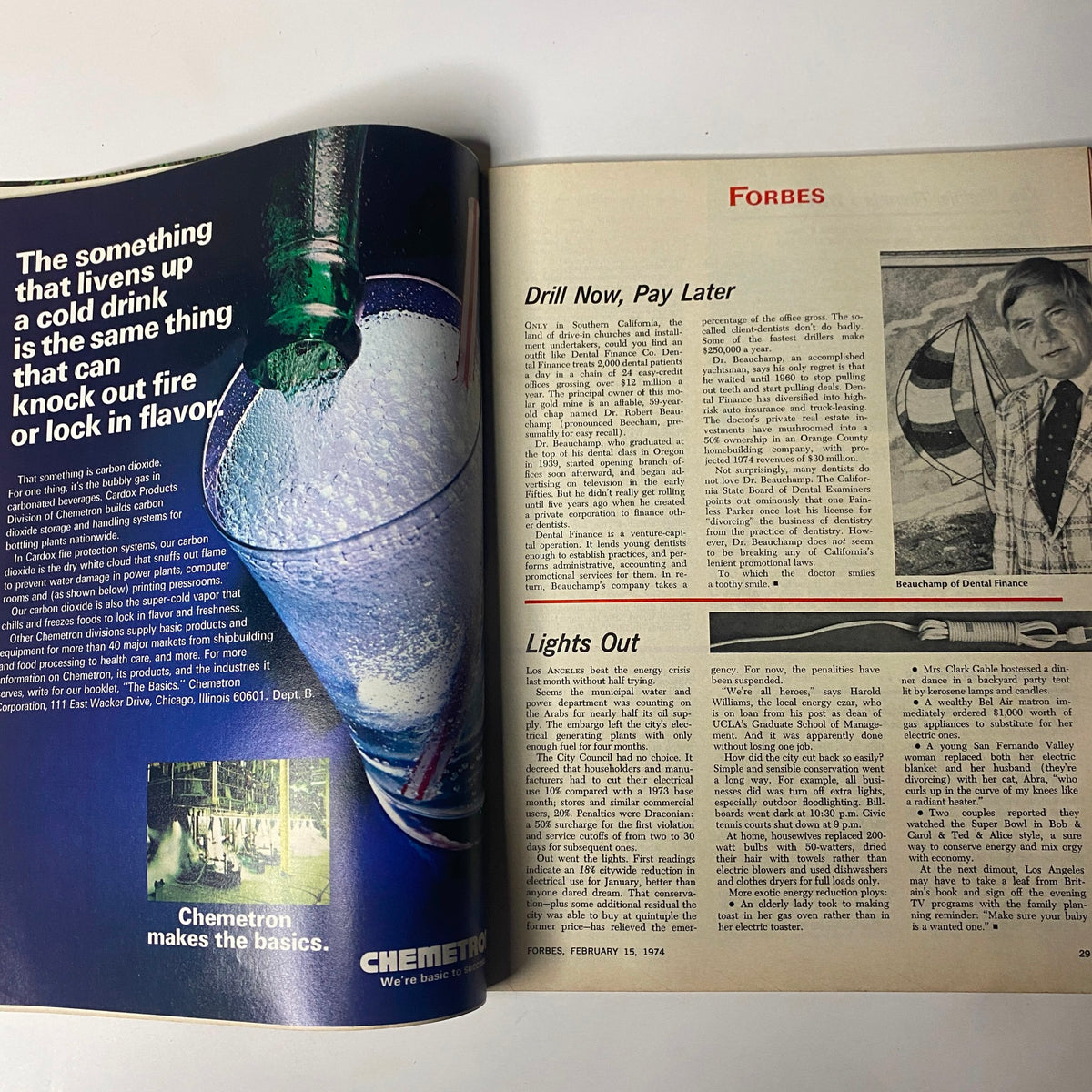 Interior pages of Forbes Magazine from February 15, 1974, showcasing advertisements and articles about business trends during the early 1970s.