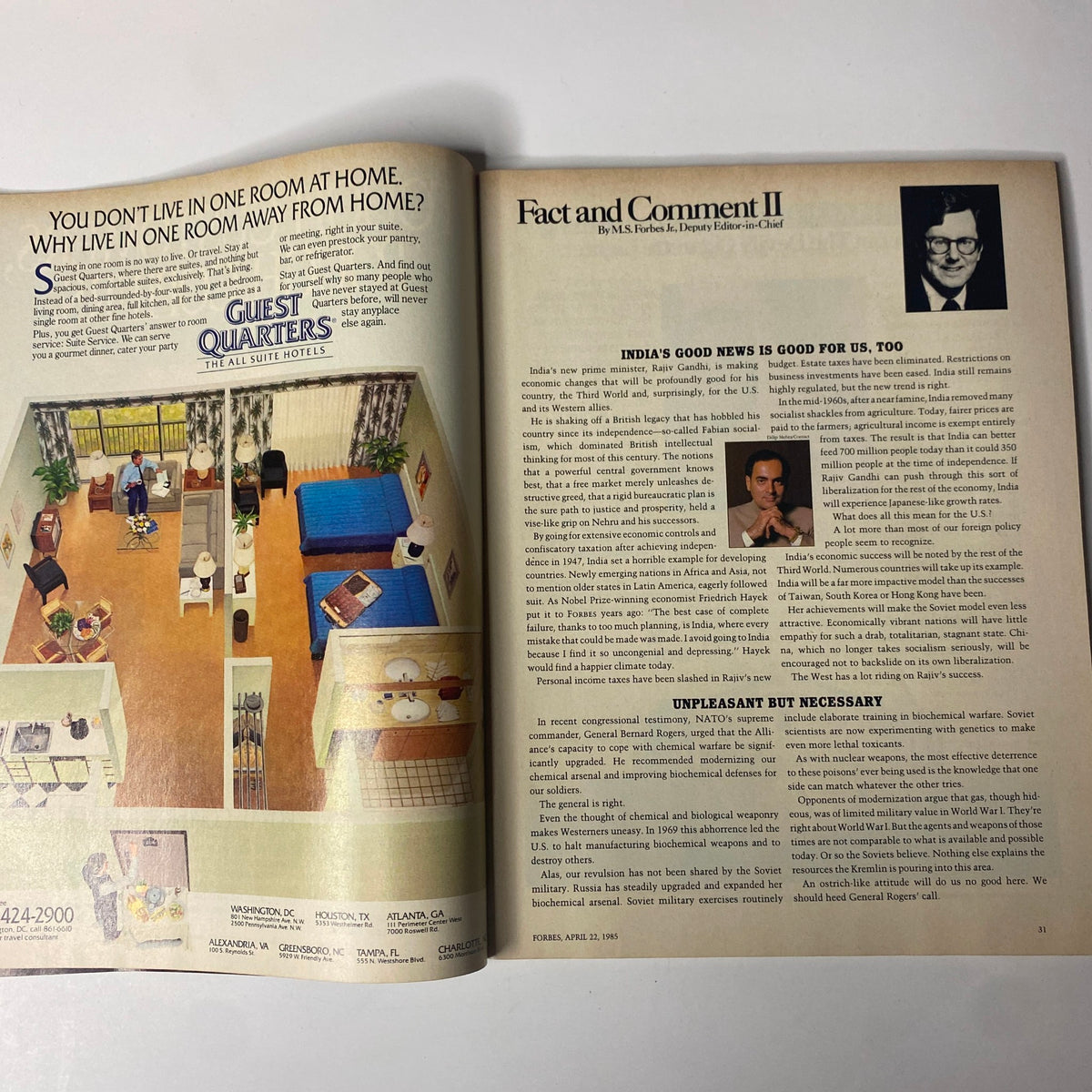 Article spread from Forbes Magazine April 22, 1985, featuring a discussion on India's economic impact and an advertisement for Guest Quarters hotels.
