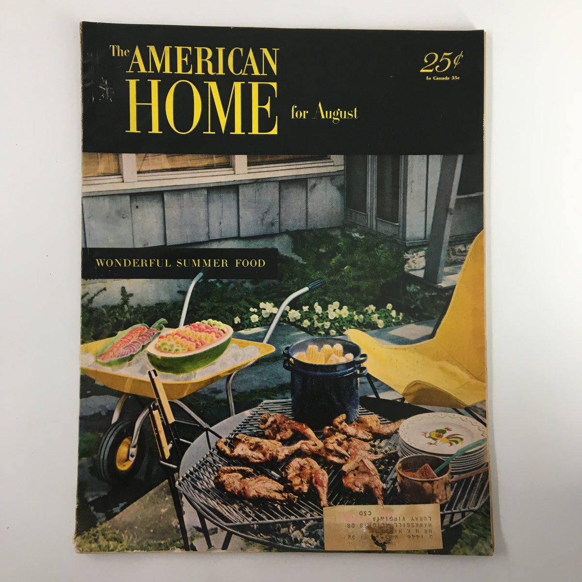 Cover of VTG The American Home Magazine August 1951 featuring 'Big Story About Little Fish', showcasing outdoor summer food preparation with grilled chicken, melons, and a vibrant yellow chair.